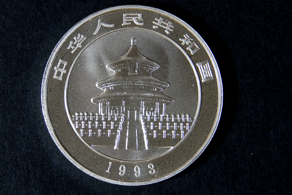 Collection of Four International Silver Coins