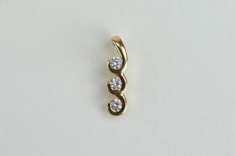 Gold Tone Rings and Pendant