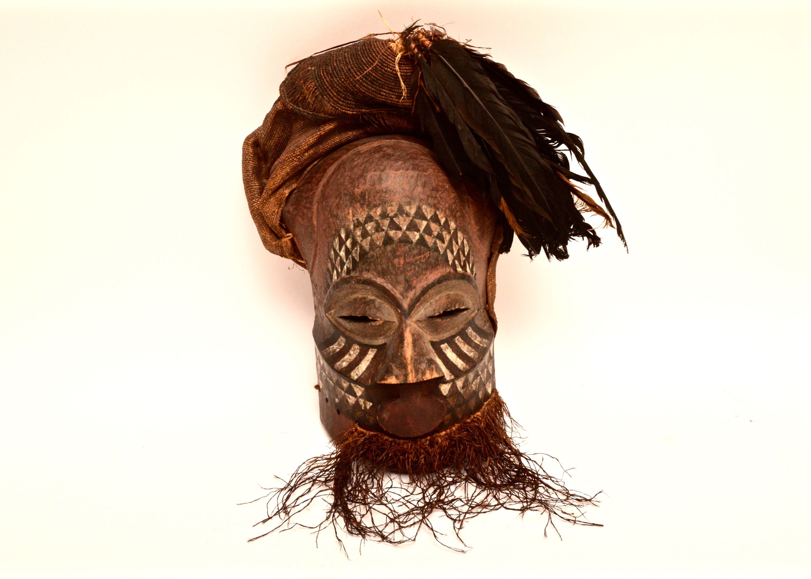 Handcrafted African Wooden Tribal Mask with Feathers