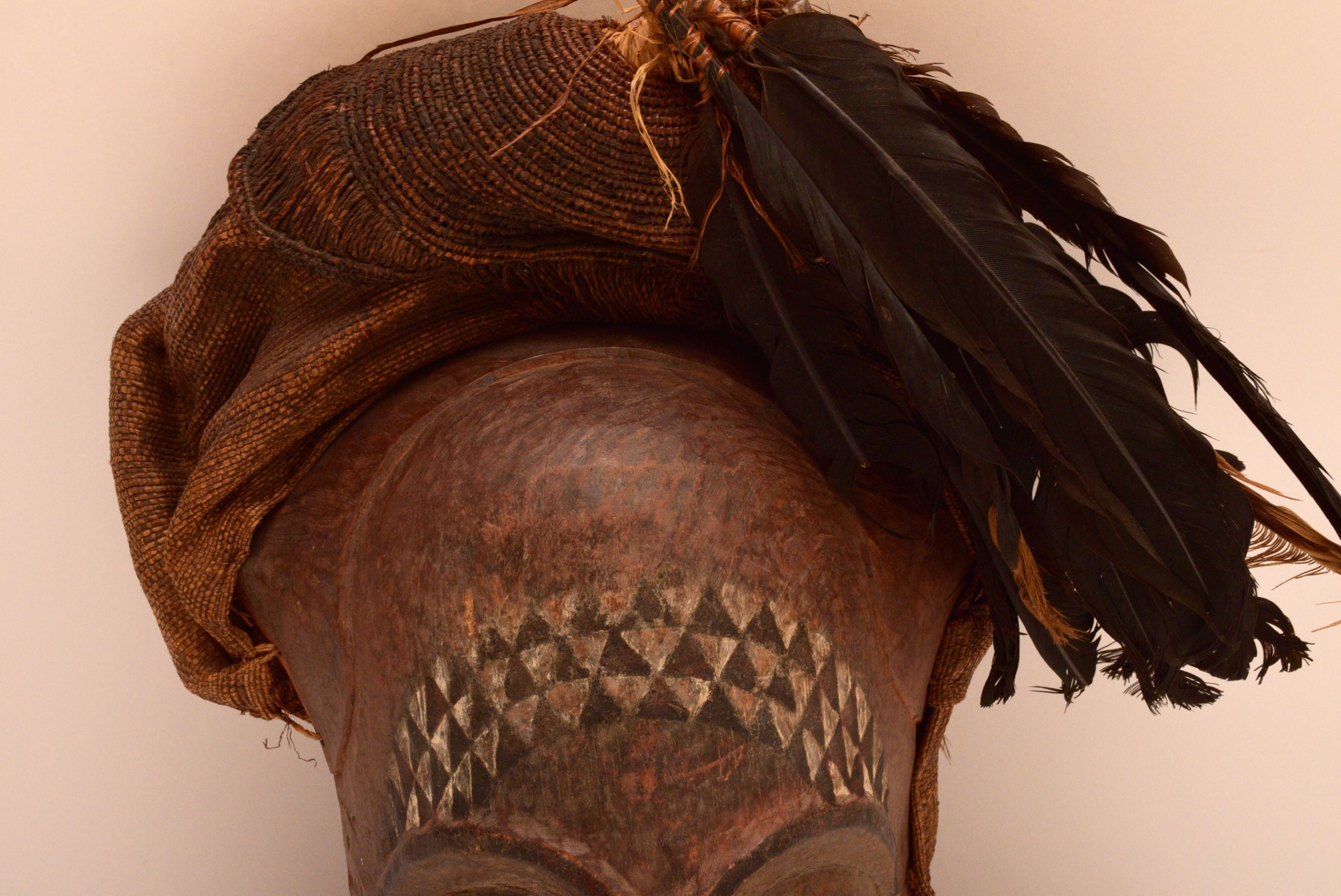 Handcrafted African Wooden Tribal Mask with Feathers