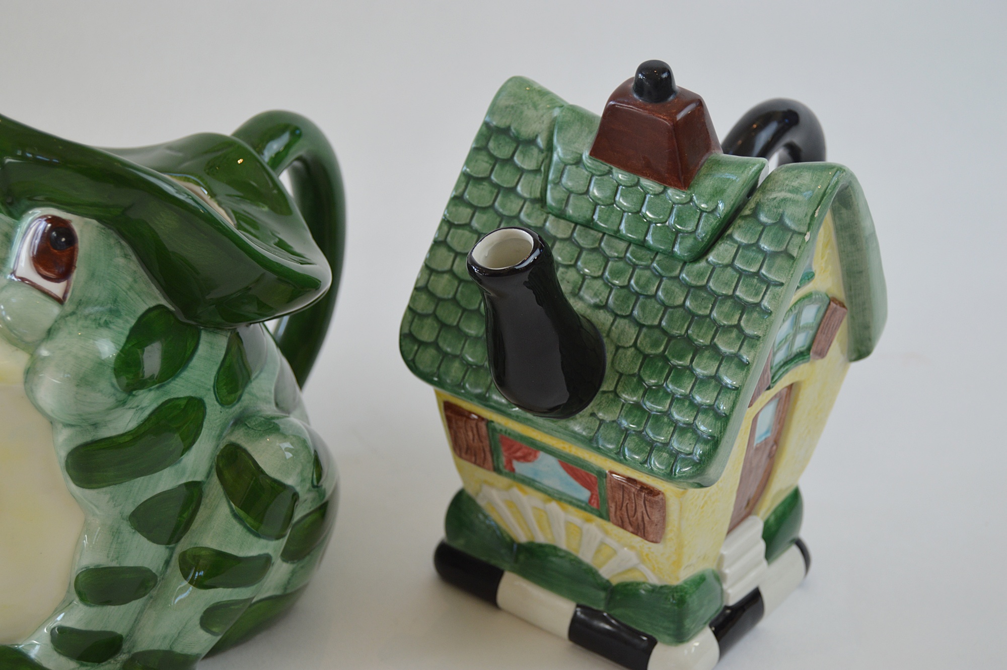 Three Ceramic Teapots, with a Yellow Tiffany Pot