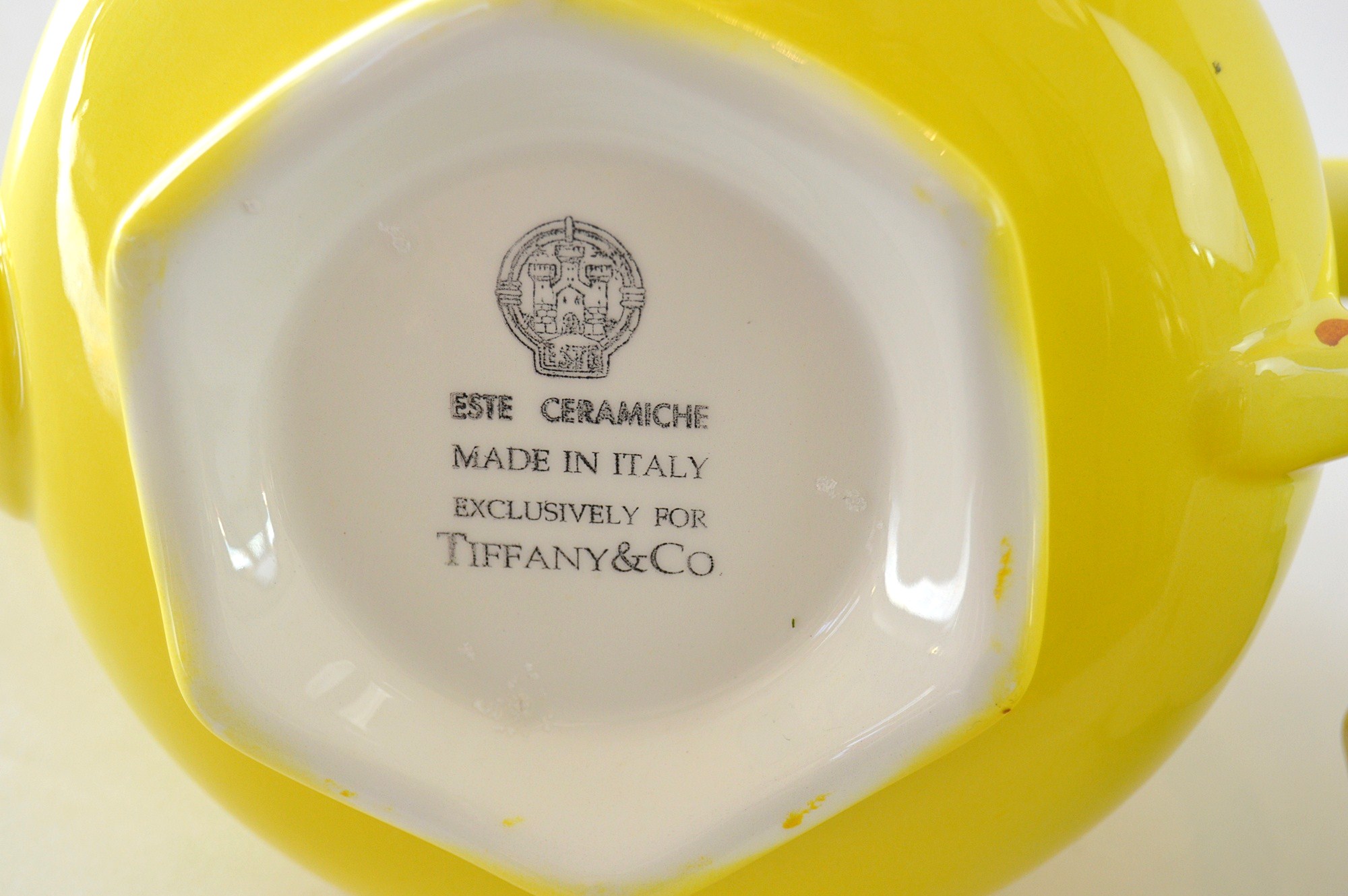 Three Ceramic Teapots, with a Yellow Tiffany Pot