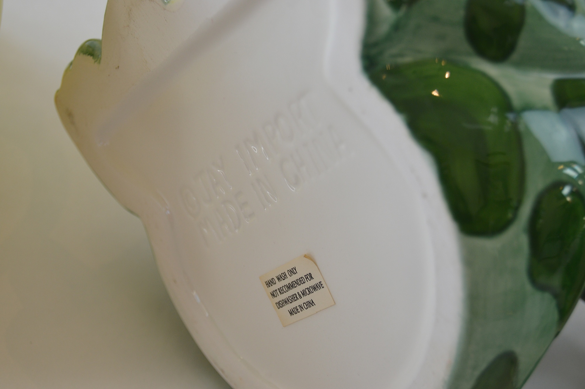 Three Ceramic Teapots, with a Yellow Tiffany Pot