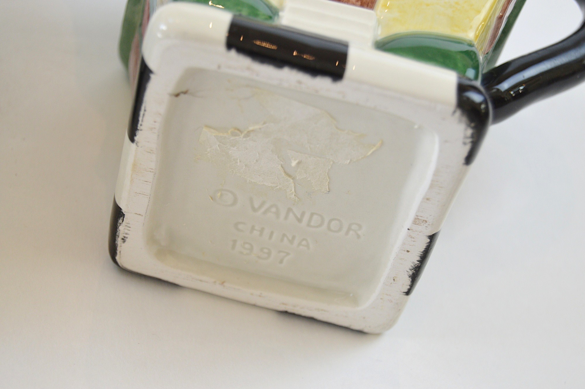 Three Ceramic Teapots, with a Yellow Tiffany Pot