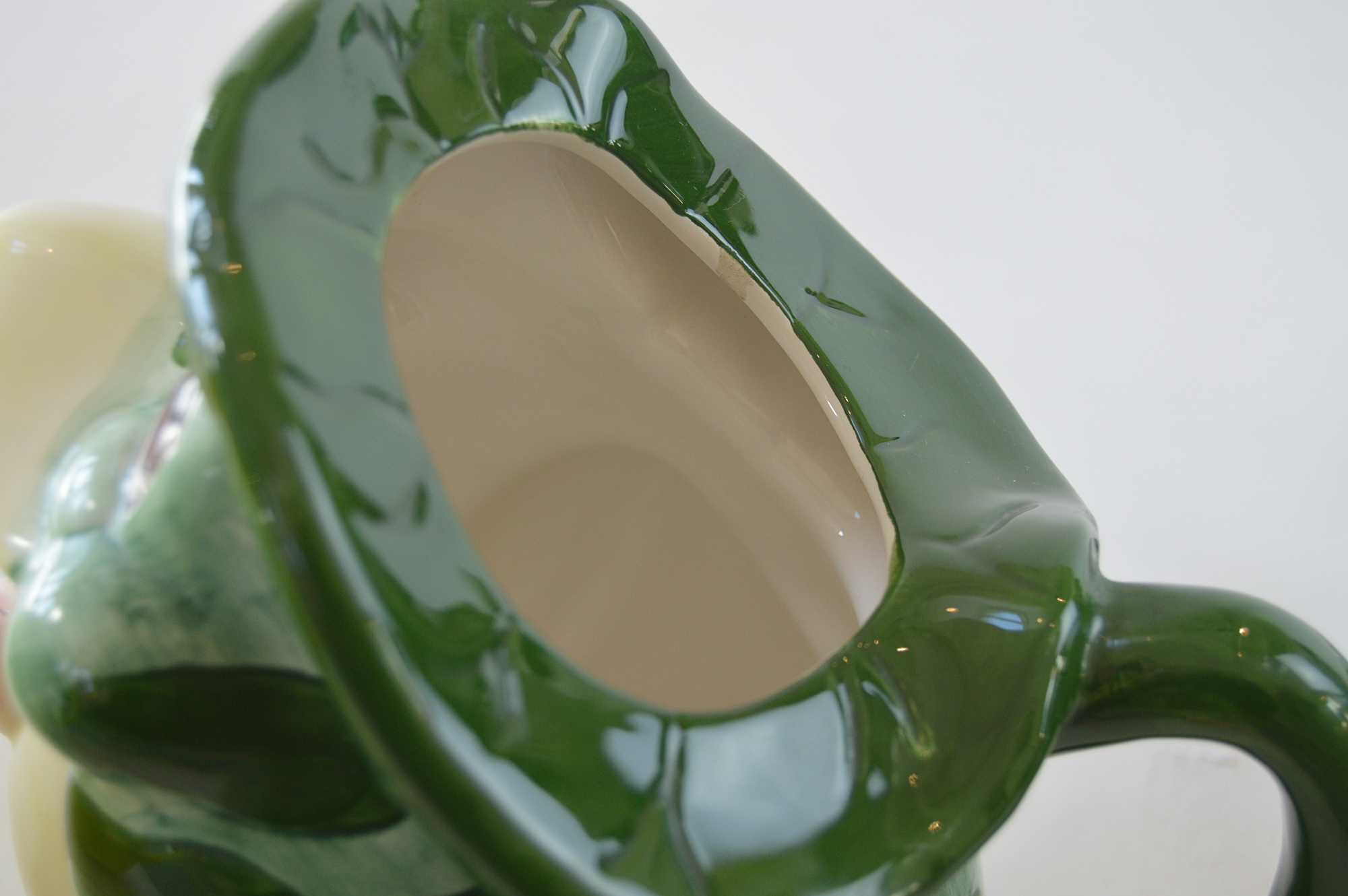Three Ceramic Teapots, with a Yellow Tiffany Pot