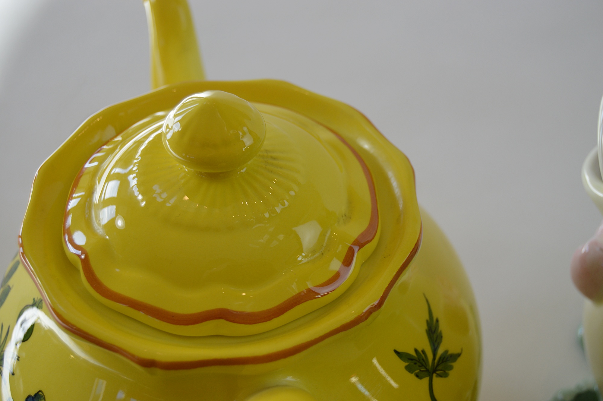 Three Ceramic Teapots, with a Yellow Tiffany Pot