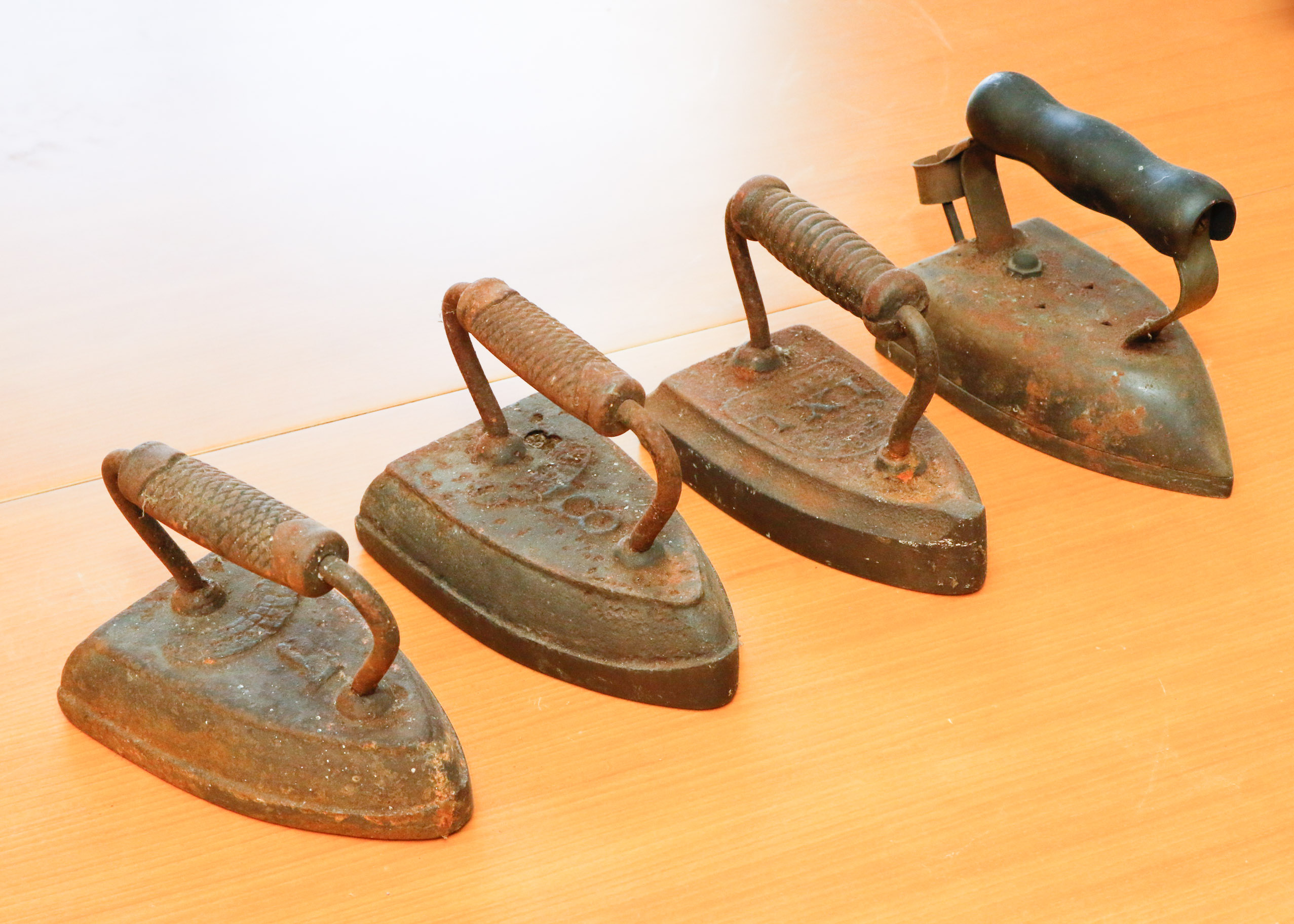 Collection of Four Antique Cast Iron Sad Irons