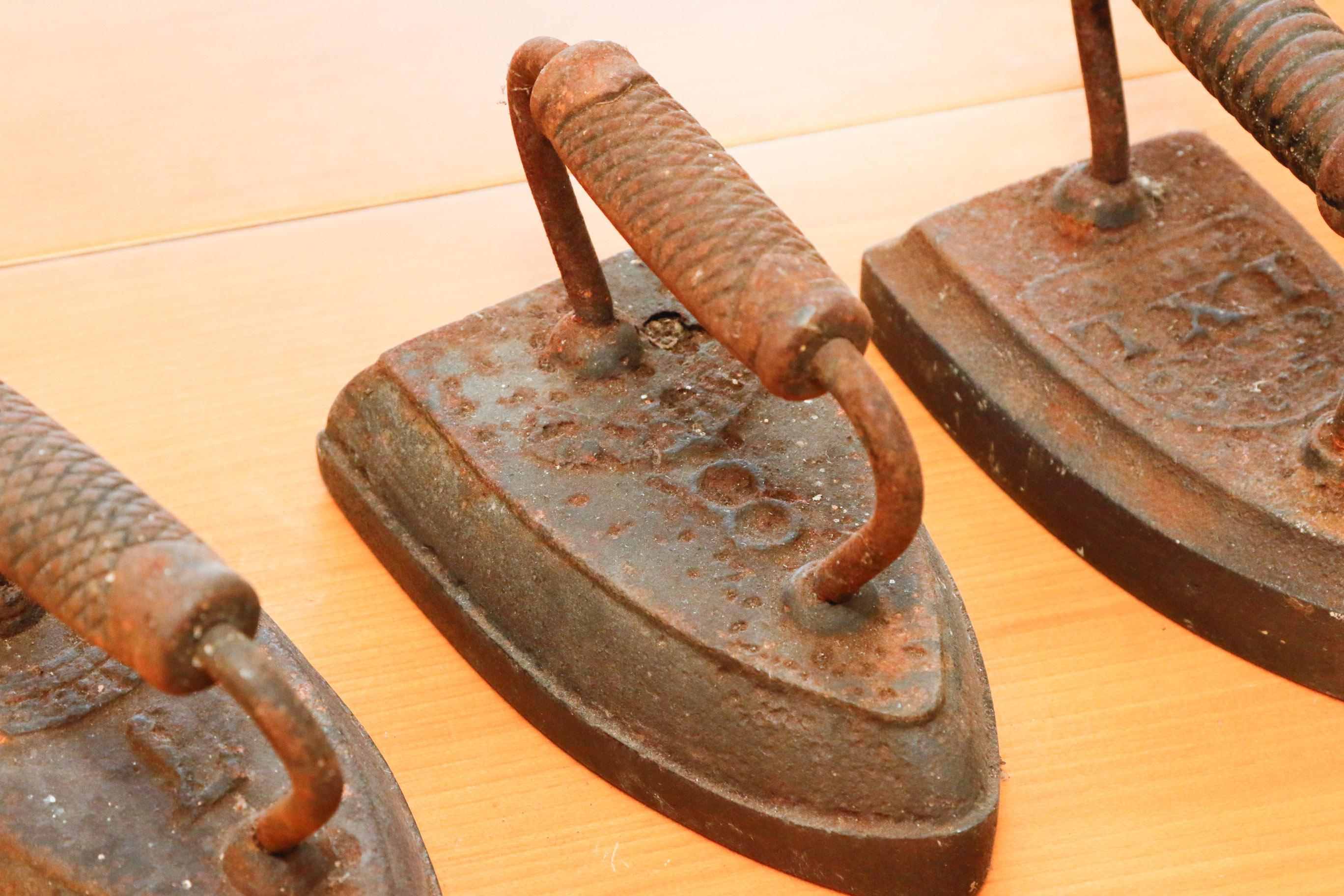 Collection of Four Antique Cast Iron Sad Irons