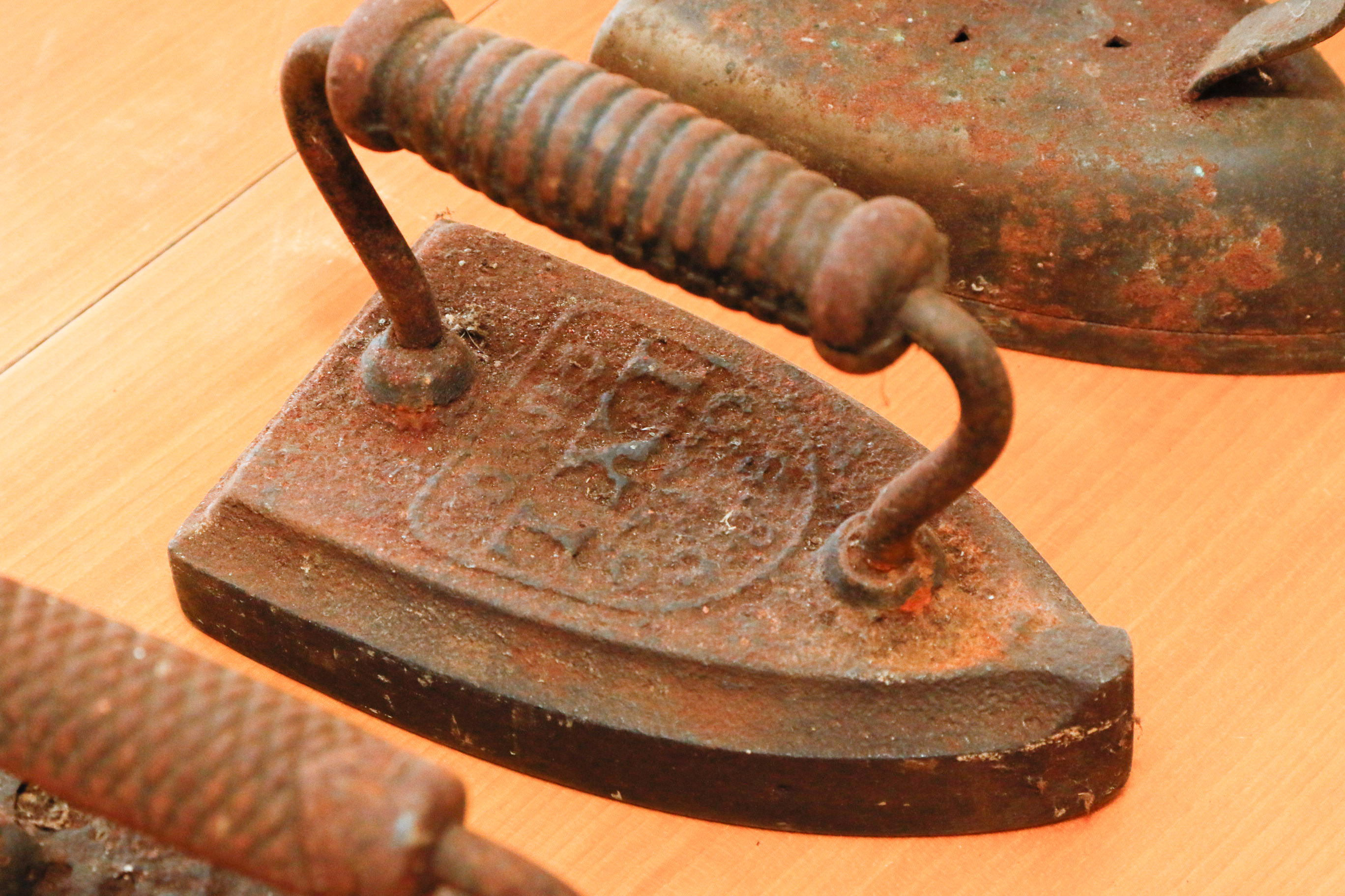 Collection of Four Antique Cast Iron Sad Irons