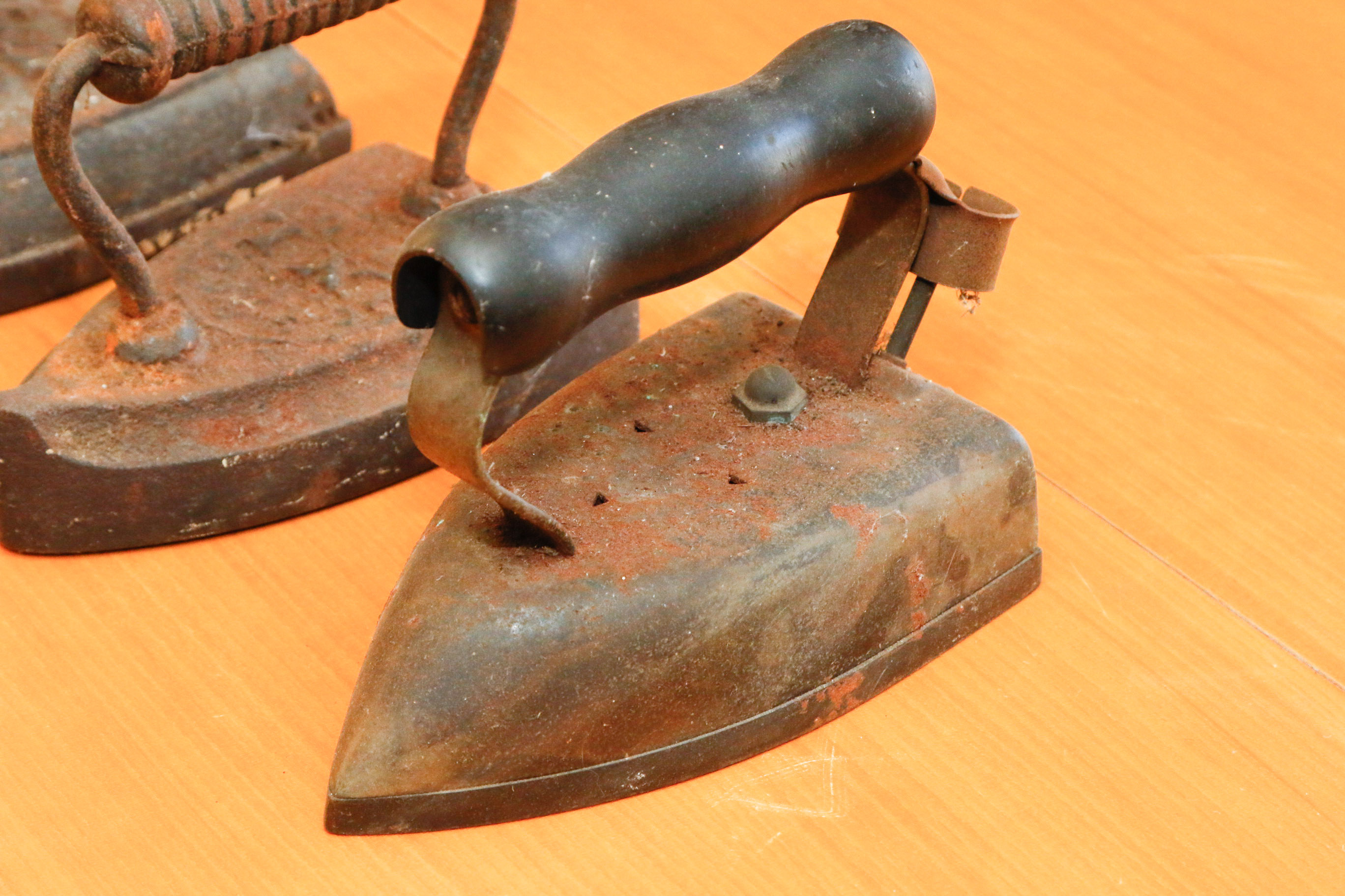 Collection of Four Antique Cast Iron Sad Irons