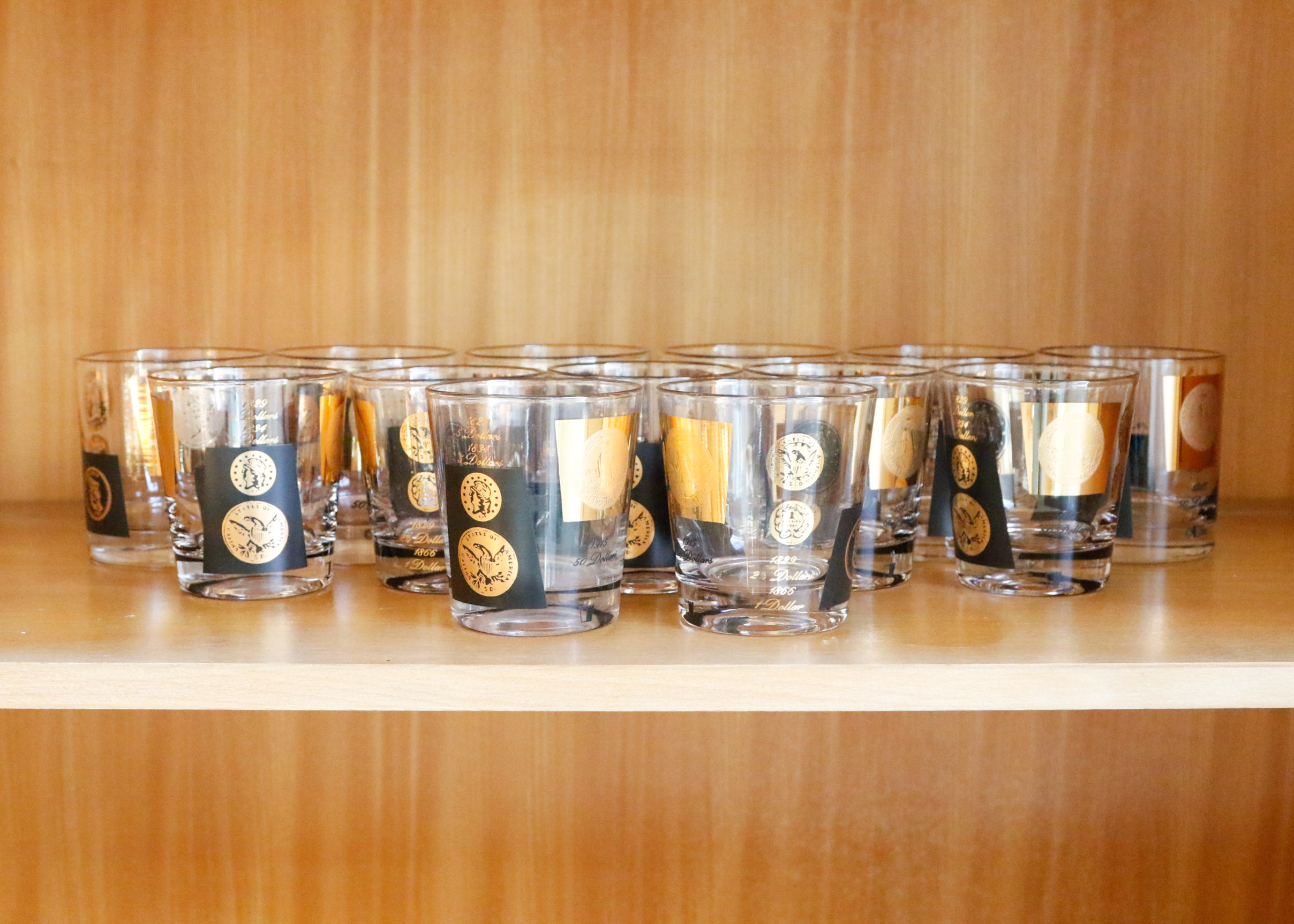 Set of Twelve Vintage Black and Gold U.S. Coin Theme Tumblers