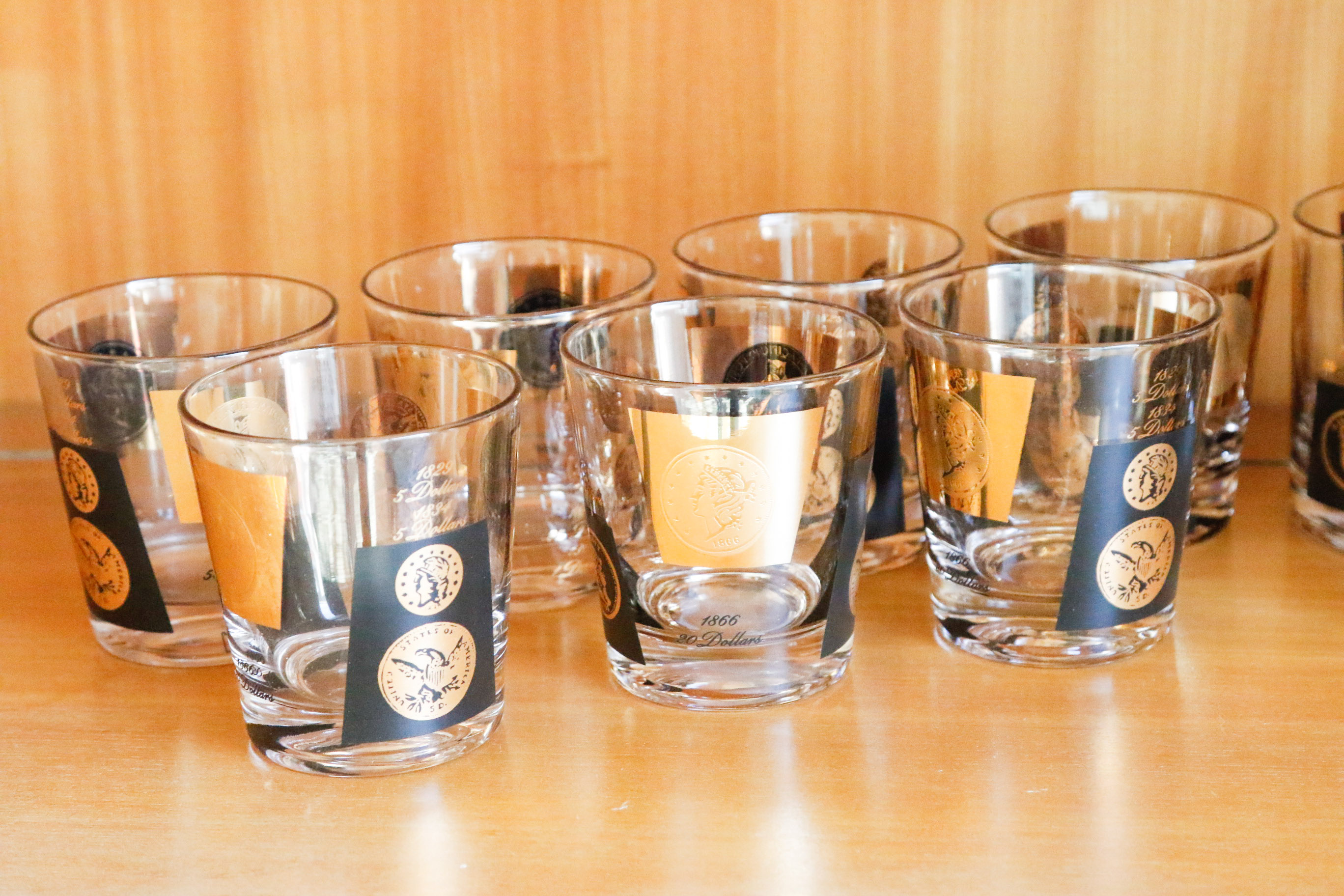 Set of Twelve Vintage Black and Gold U.S. Coin Theme Tumblers