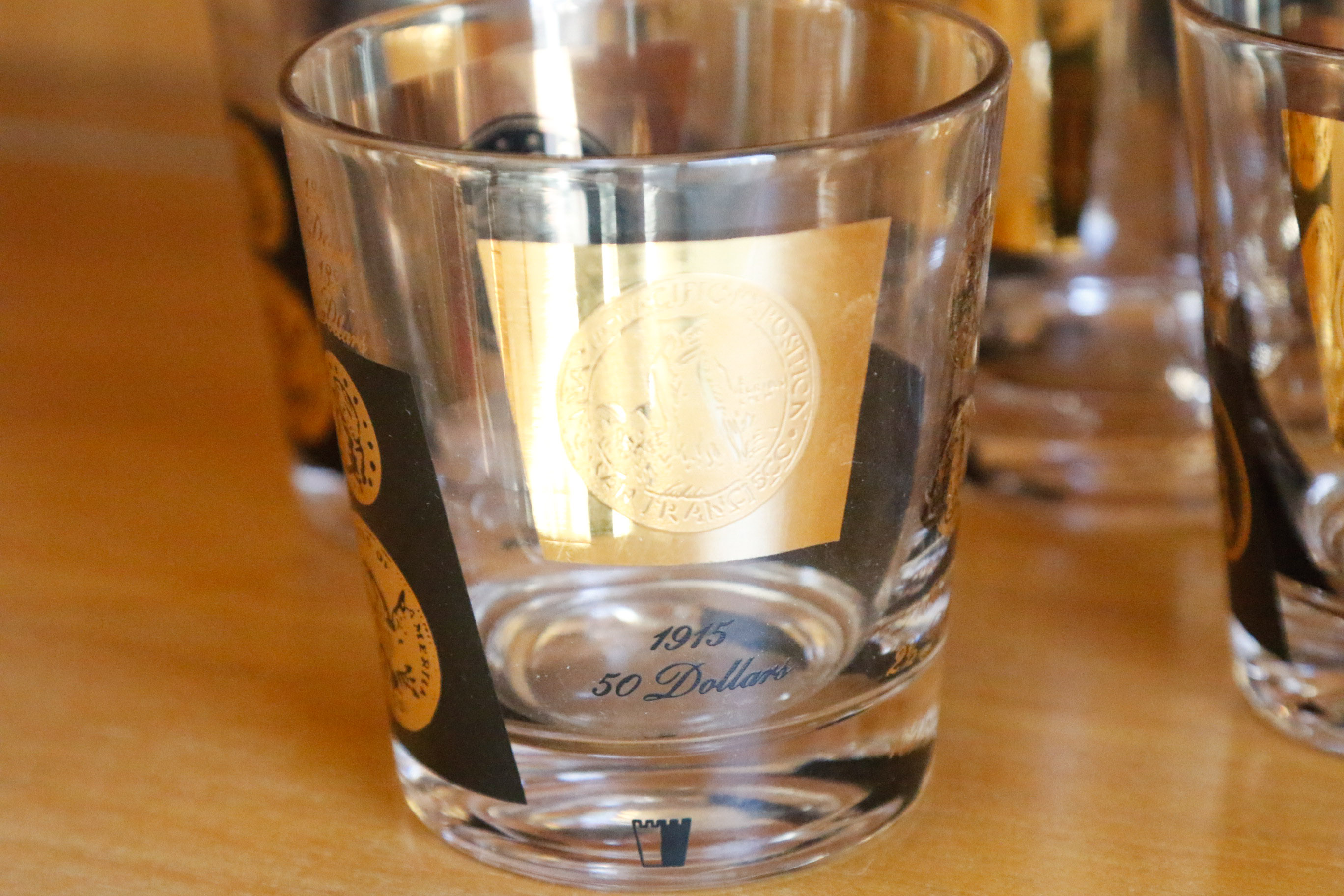 Set of Twelve Vintage Black and Gold U.S. Coin Theme Tumblers