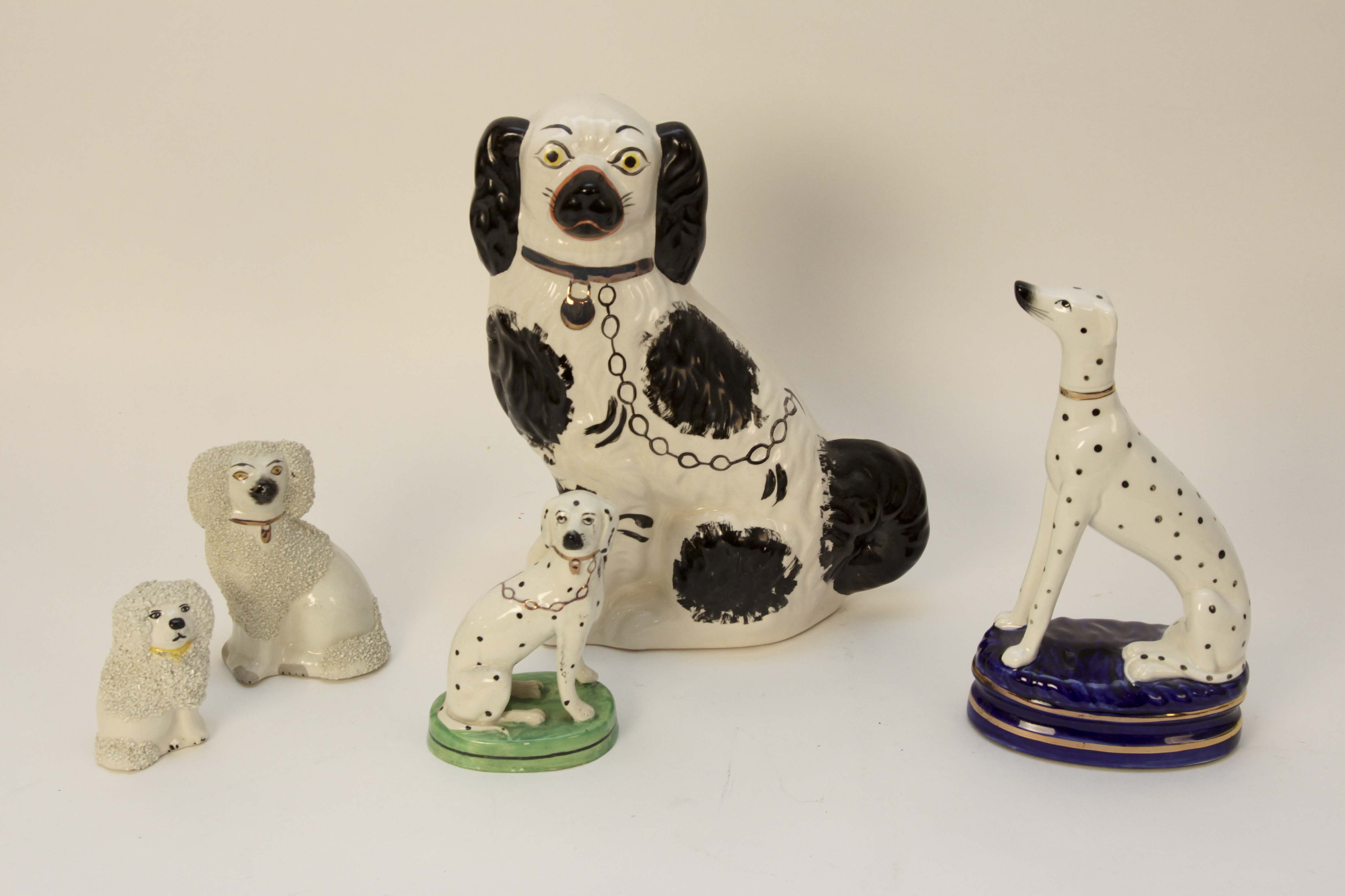 Four Vintage Porcelain Dog Figurines
