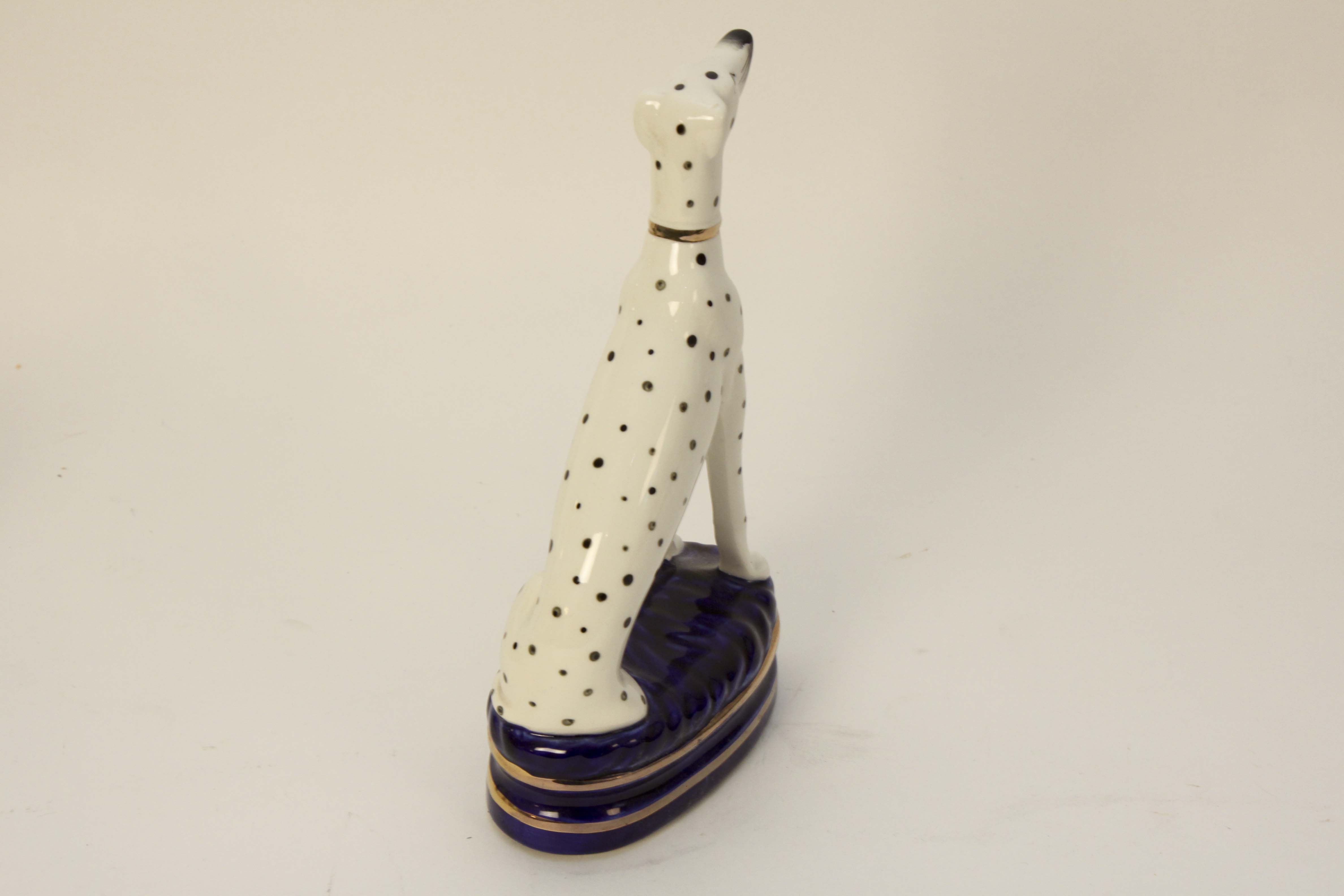 Four Vintage Porcelain Dog Figurines