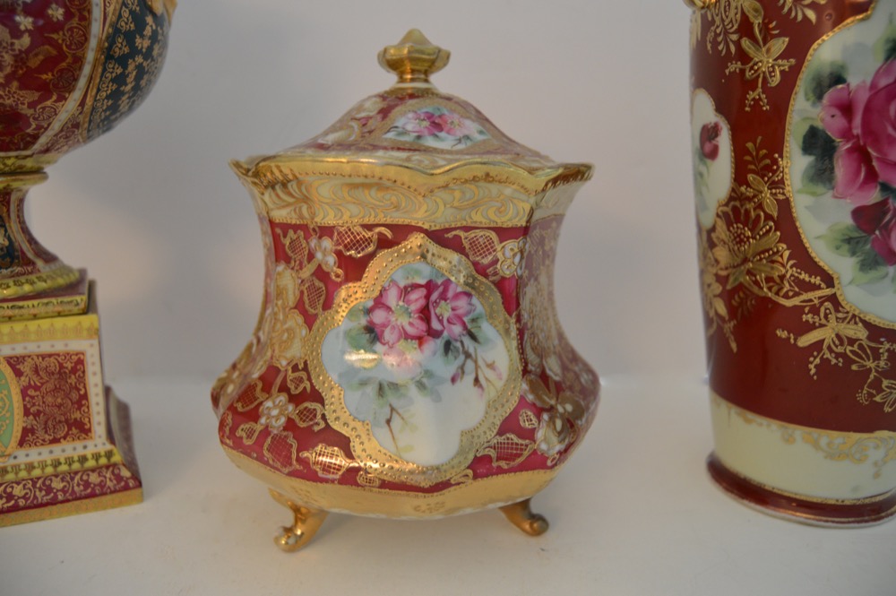 Three Decorative Ceramic Items With a Red Theme