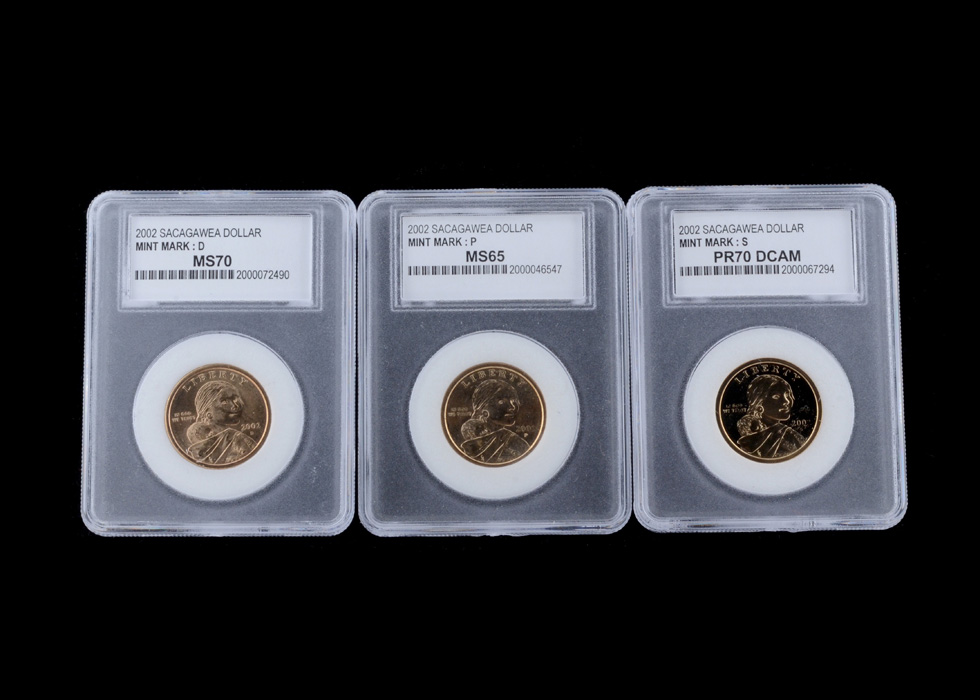 Three Encapsulated and Graded Sacagawea Golden Dollars