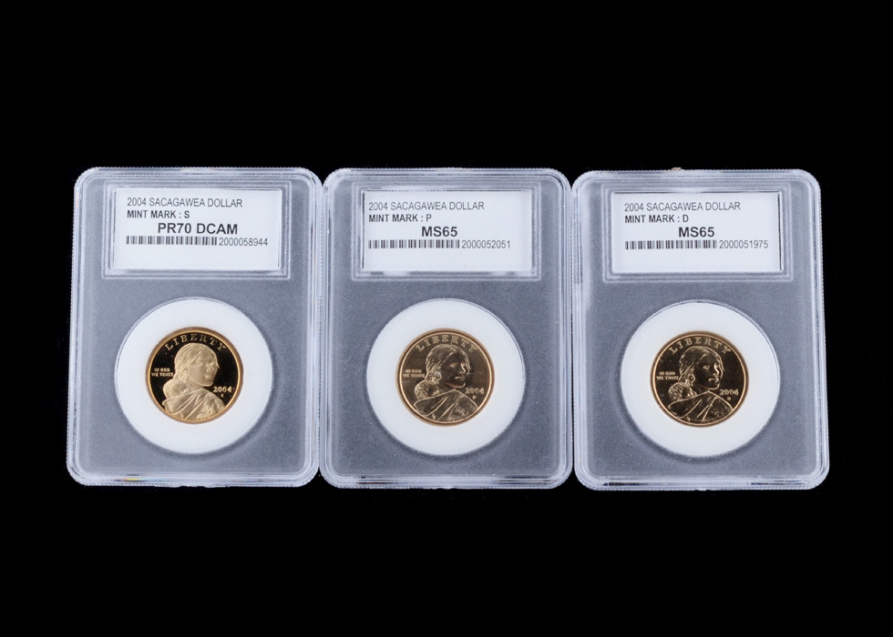 Three Encapsulated and Graded Sacagawea Golden Dollars