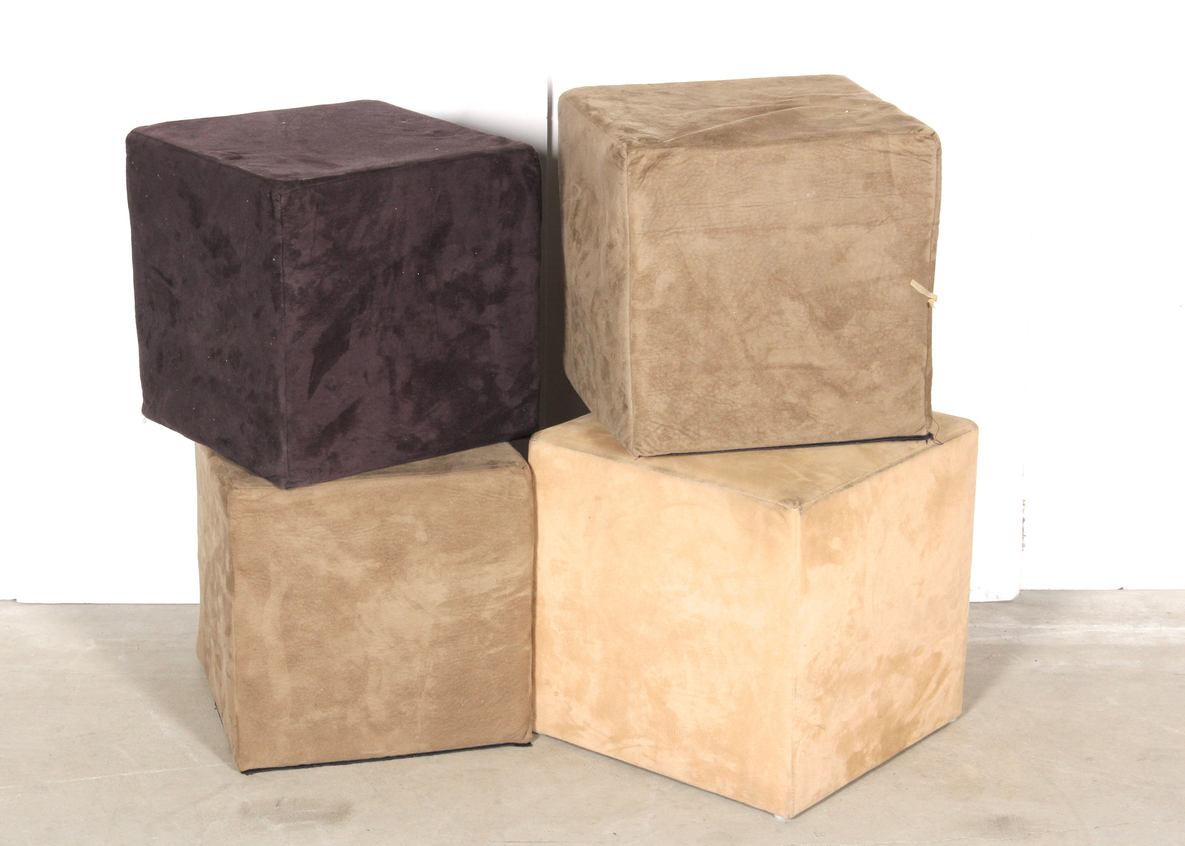 Four Small Upholstered Cubed Ottomans