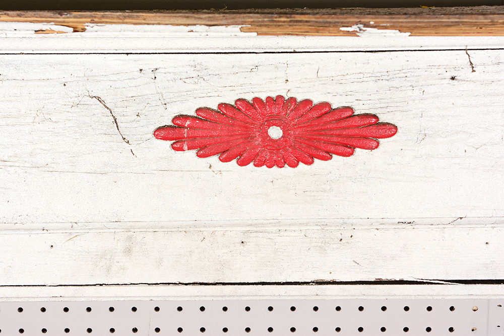 Antique Fireplace Mantel with Red Accent
