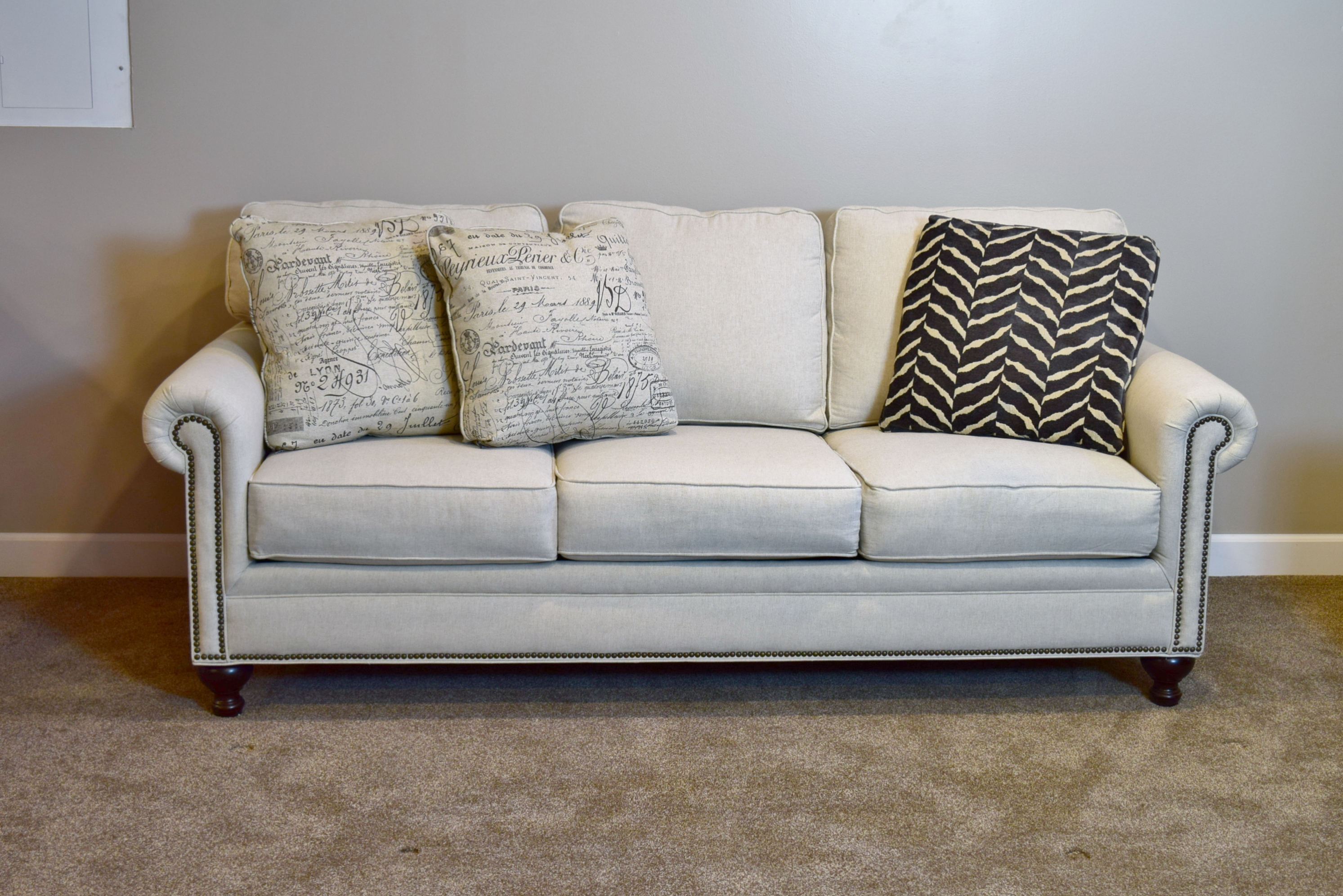 Broyhill Ivory Sofa with Accent Pillows