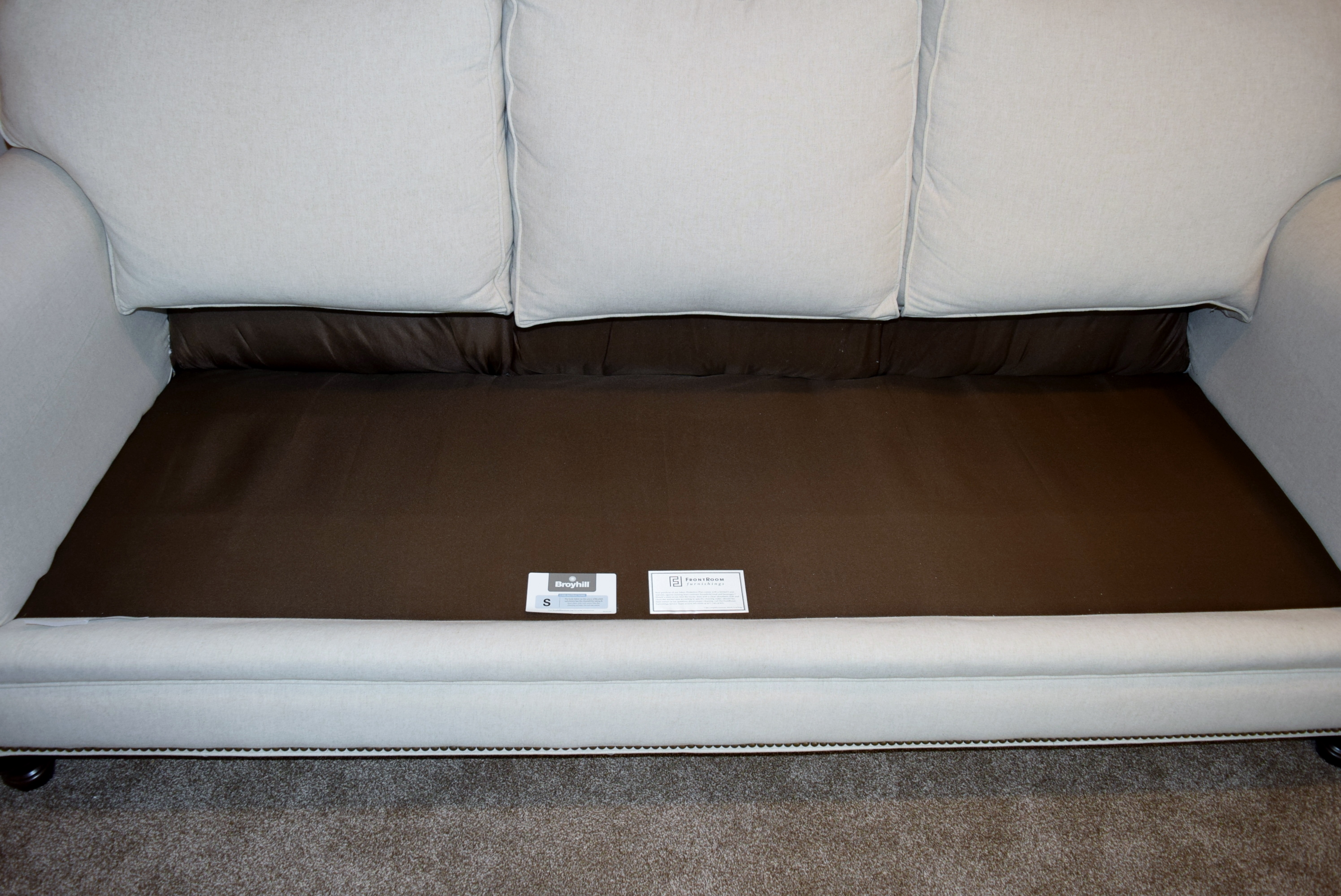 Broyhill Ivory Sofa with Accent Pillows