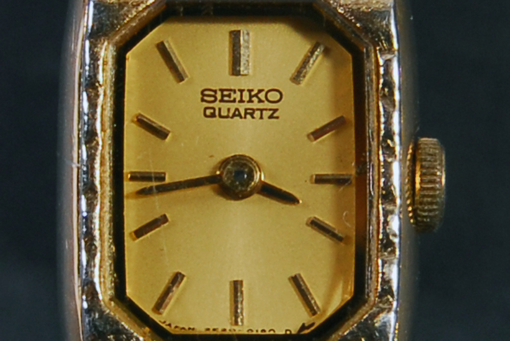 Group of Metal Bracelets and Watch