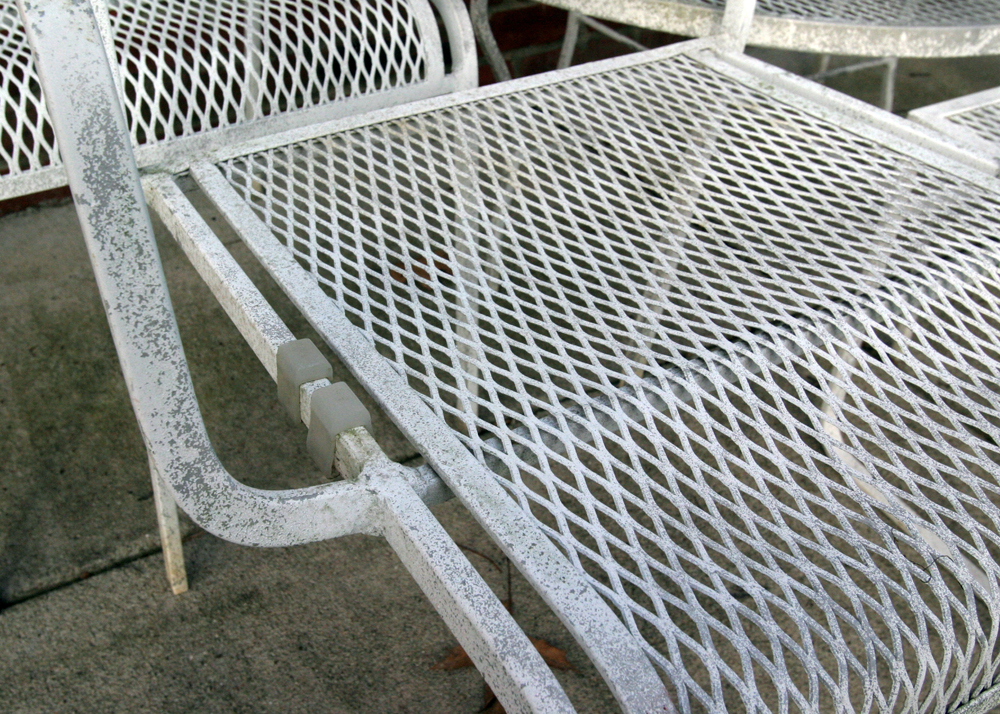 Grouping of White Mesh Patio Furniture