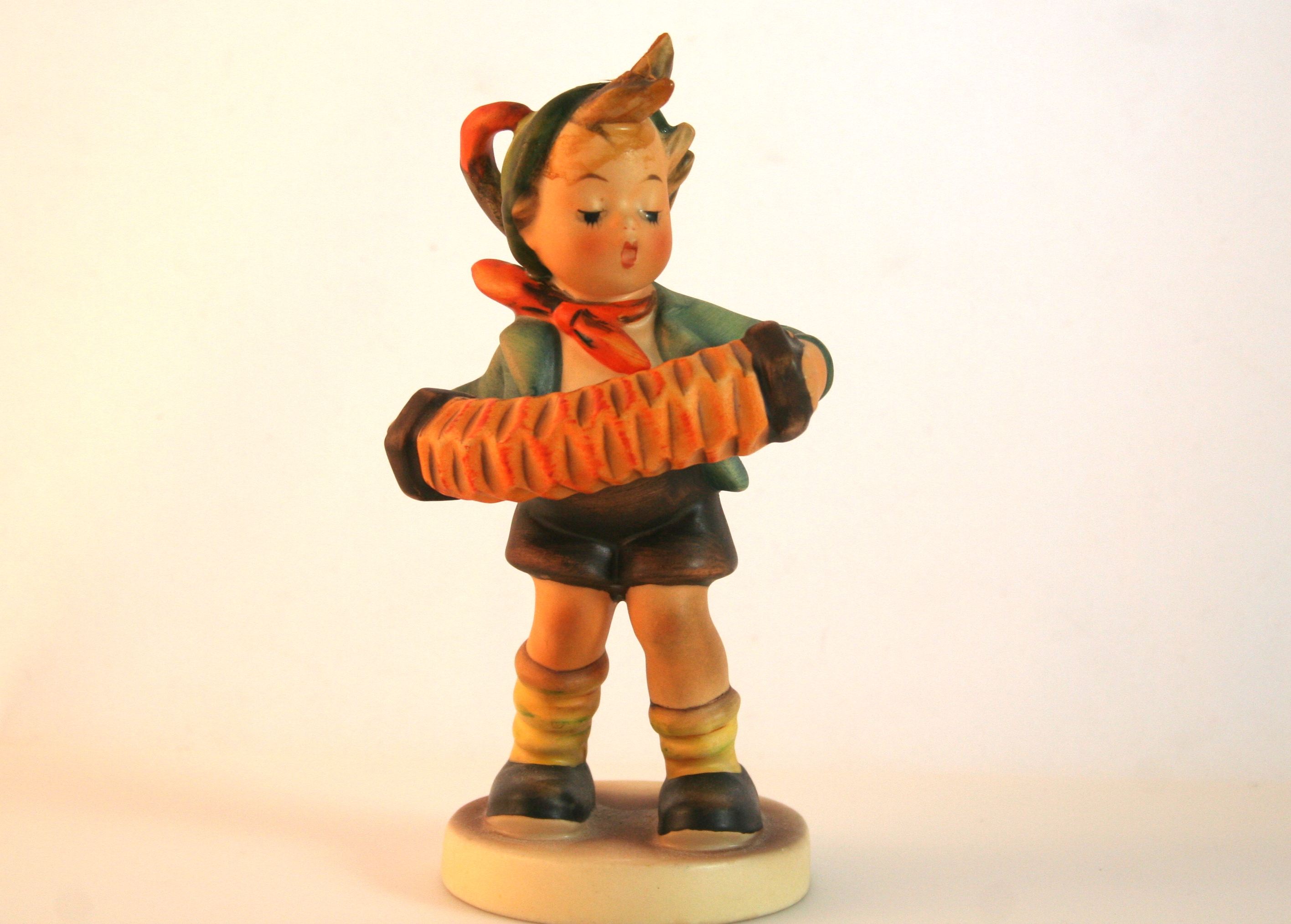 M. I. Hummel Figurines "Accordion Boy" and "Baker"