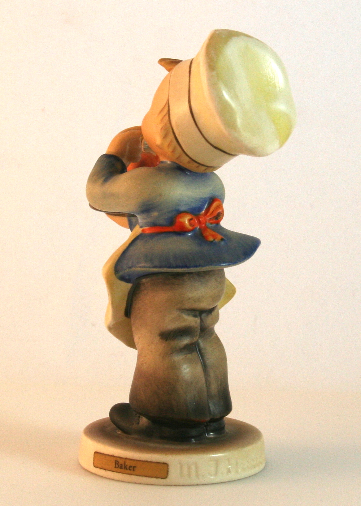 M. I. Hummel Figurines "Accordion Boy" and "Baker"