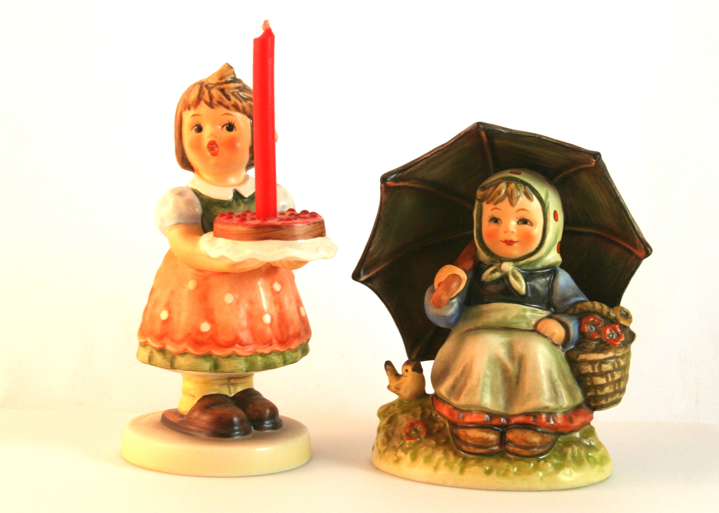 Pair of Hummel Figurines "Birthday Candle" and "Smiling Through"