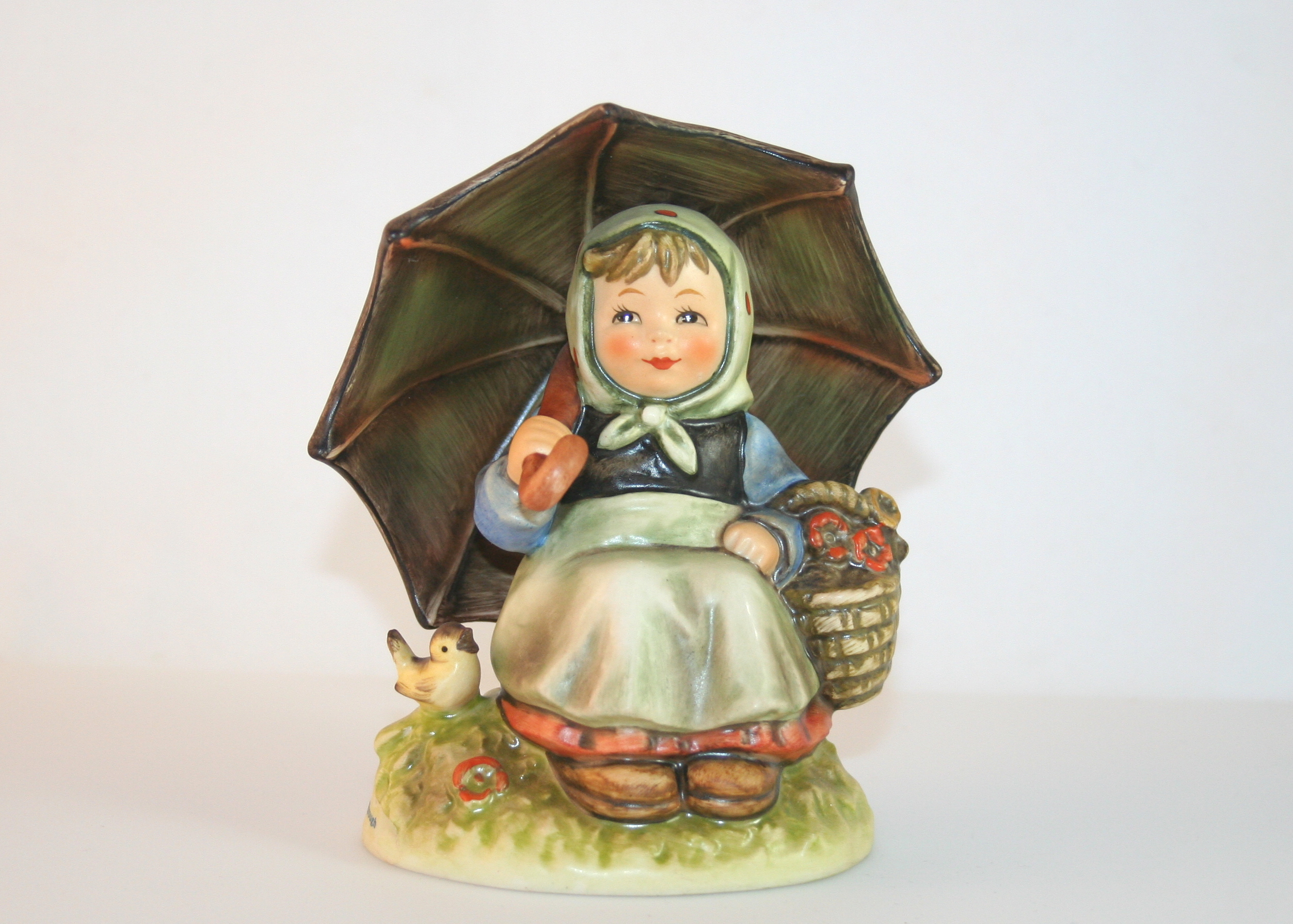 Pair of Hummel Figurines "Birthday Candle" and "Smiling Through"