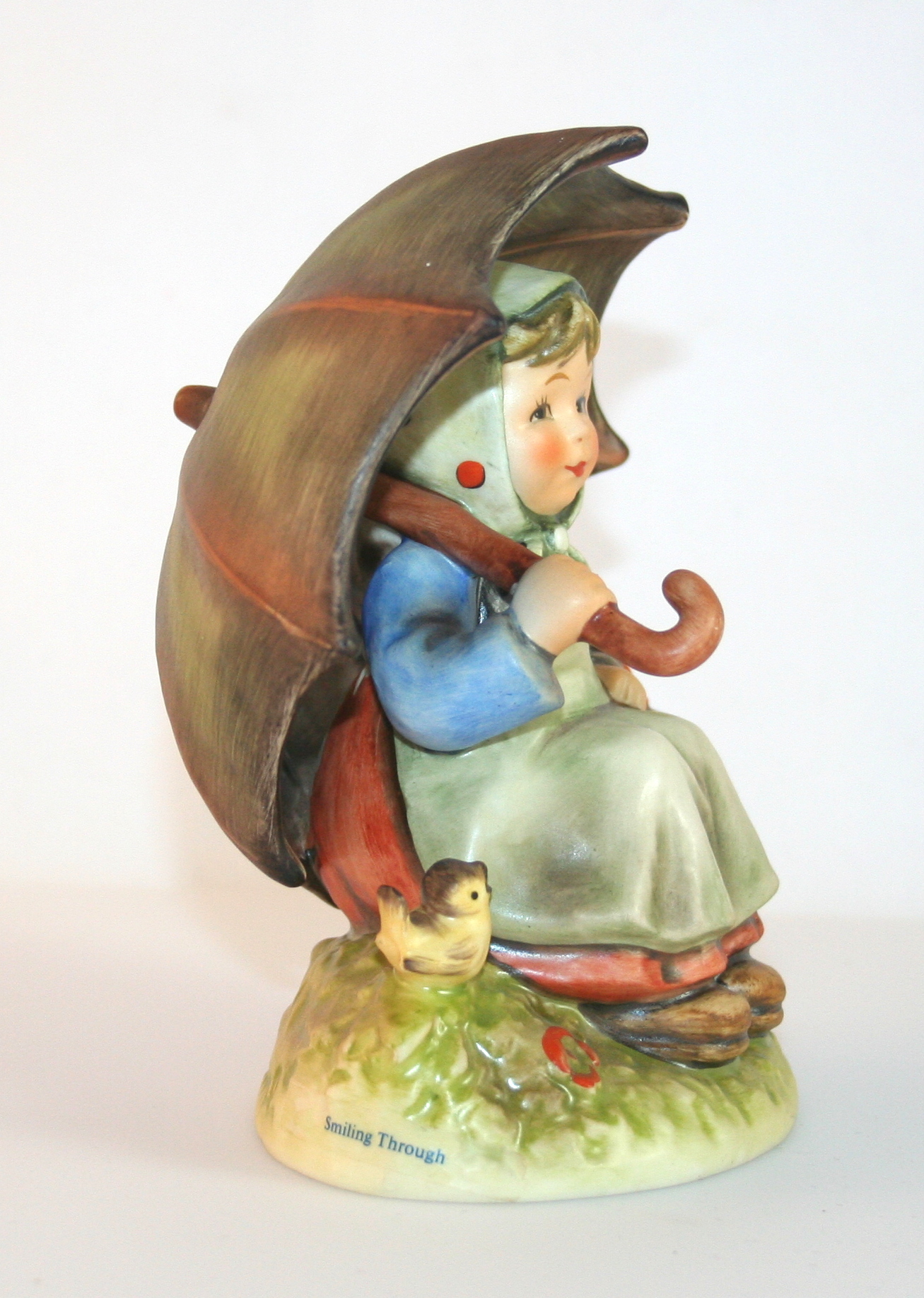 Pair of Hummel Figurines "Birthday Candle" and "Smiling Through"