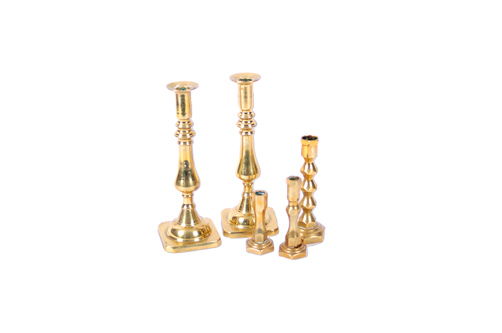 A Collection of Brass Candlesticks