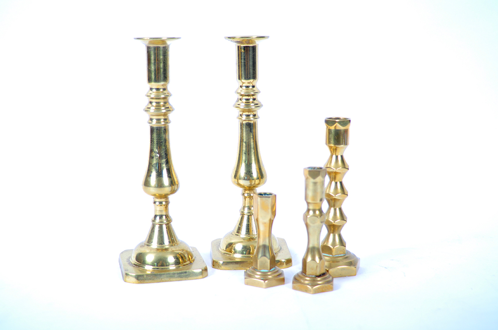 A Collection of Brass Candlesticks