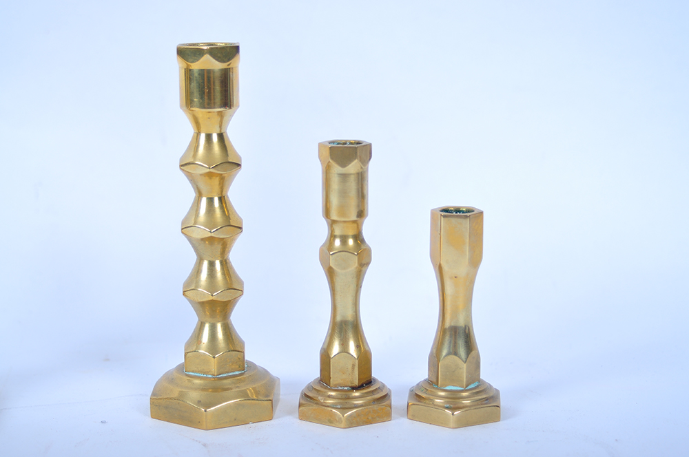 A Collection of Brass Candlesticks