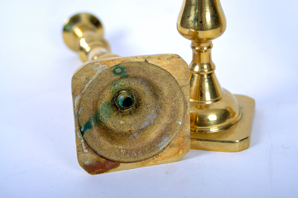A Collection of Brass Candlesticks