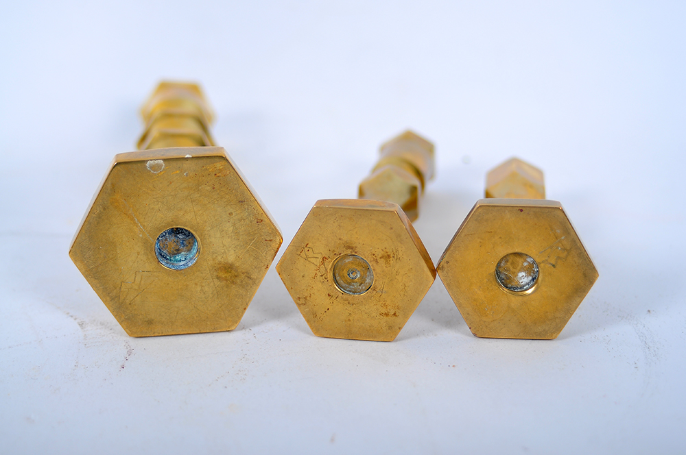A Collection of Brass Candlesticks