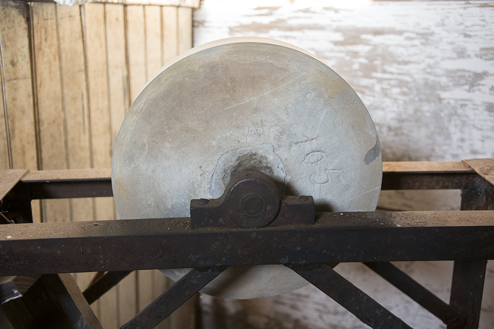 Vintage Grinding Stone on Stand