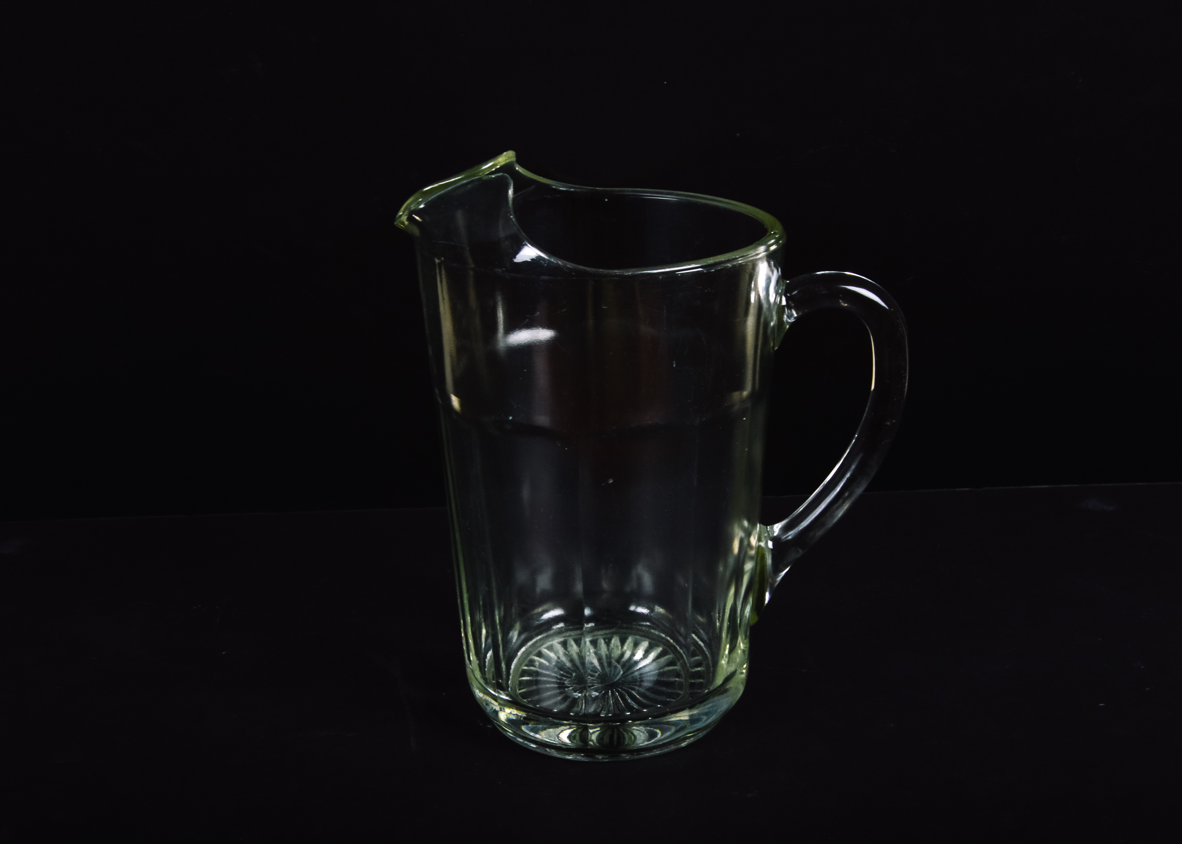 Set of Plastic Cups and a Glass Pitcher