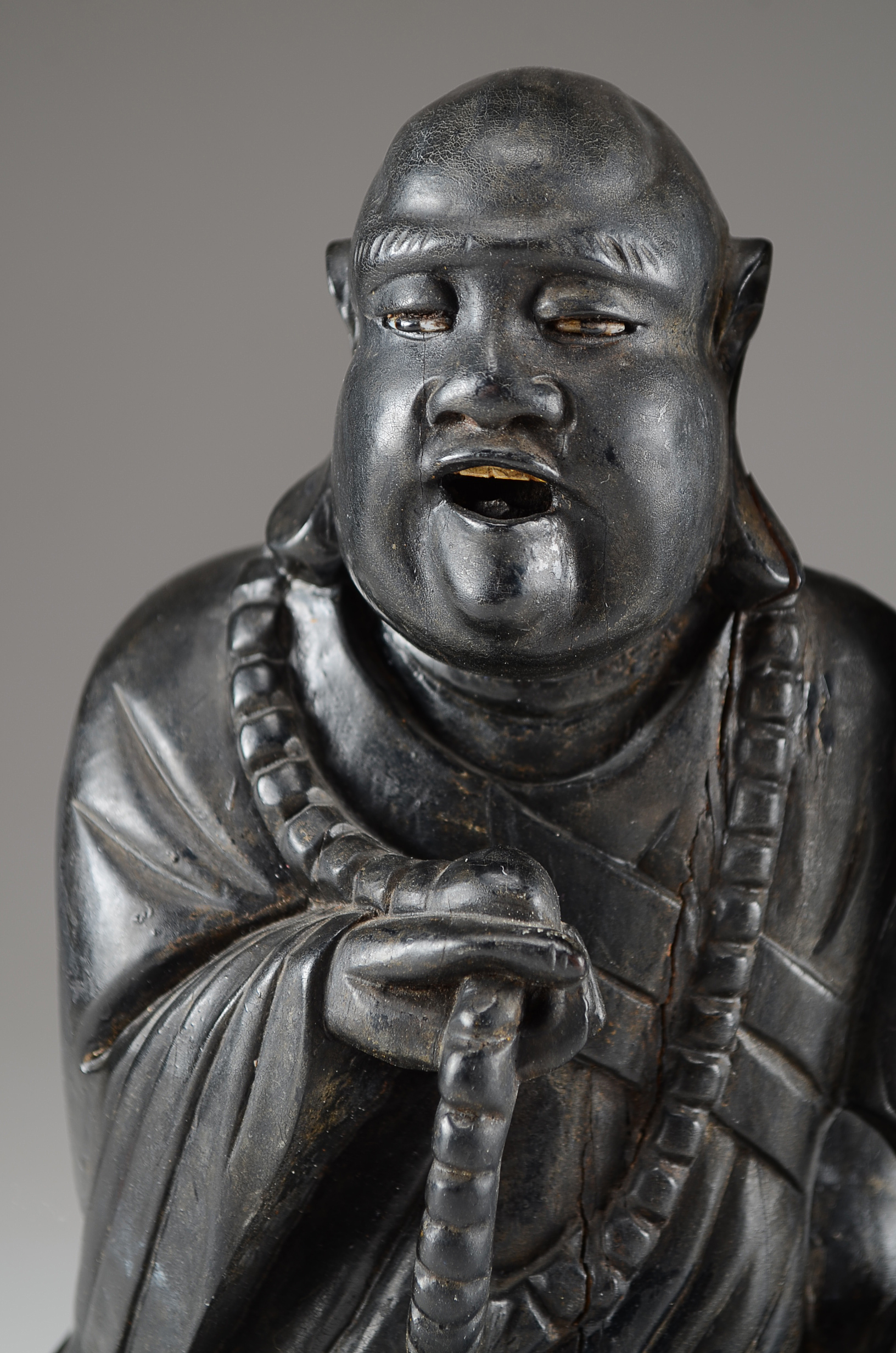 Two Asian Lacquered Wooden Buddha Candle Holders