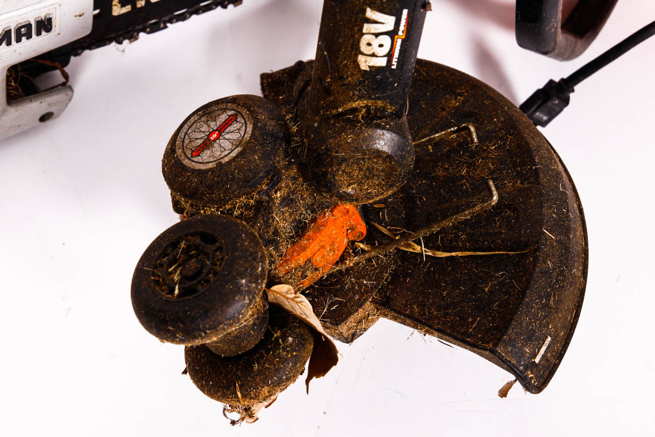 Chainsaw and Pair of Lawn Trimmers