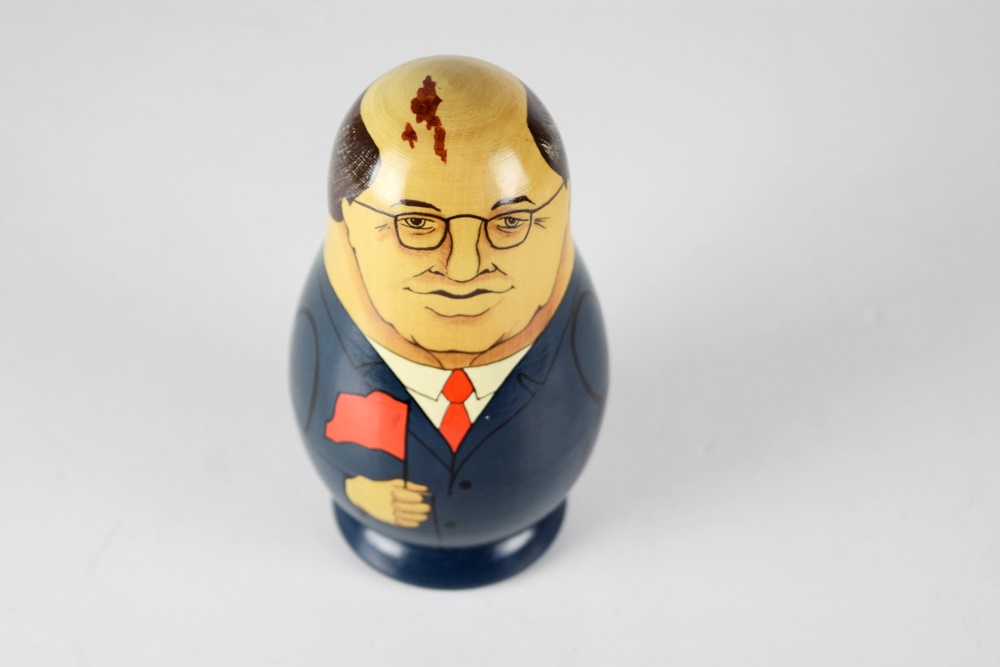 Nine Russian Nesting Dolls Representing Leaders