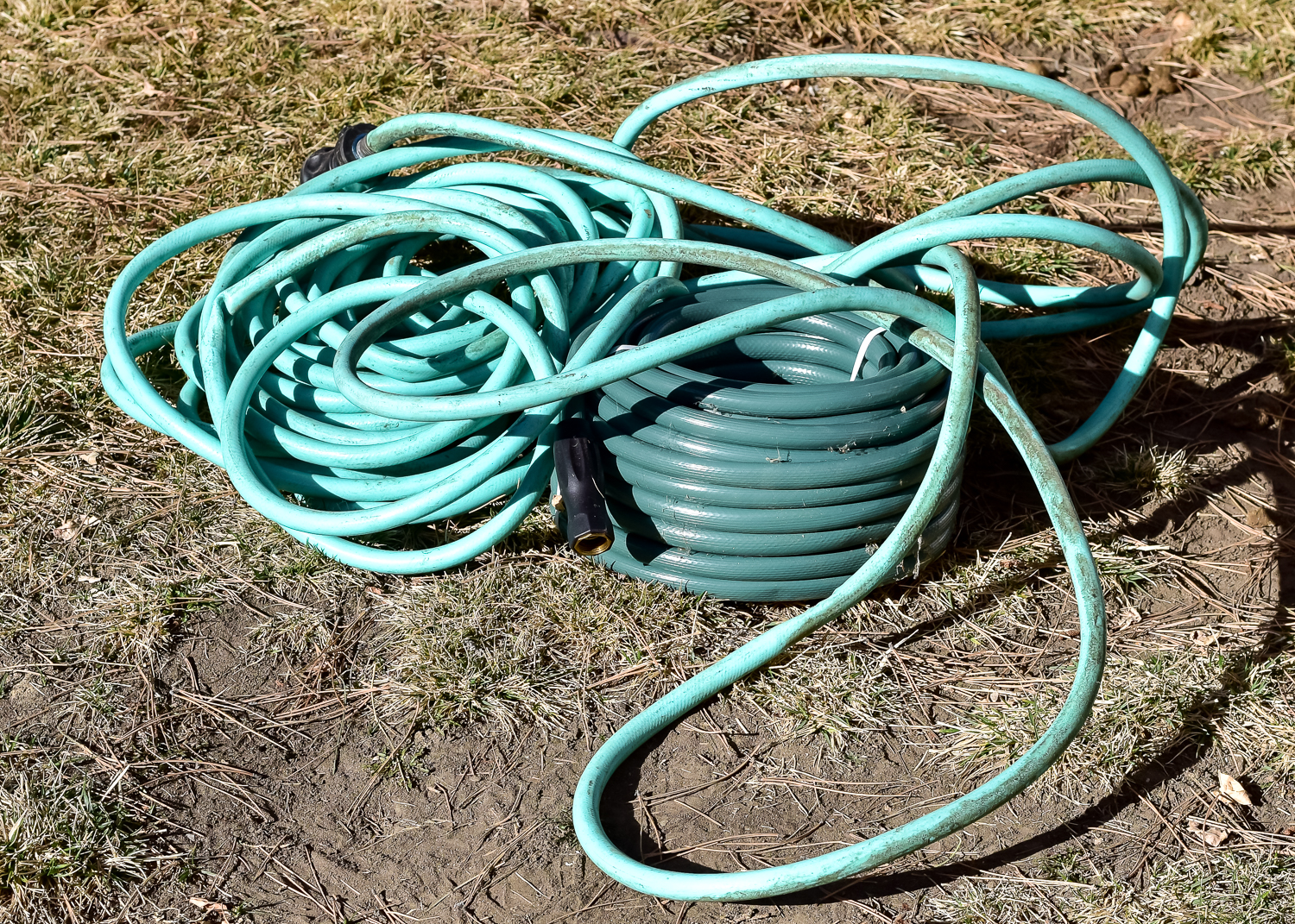 Pair of Green Vinyl Garden Hoses