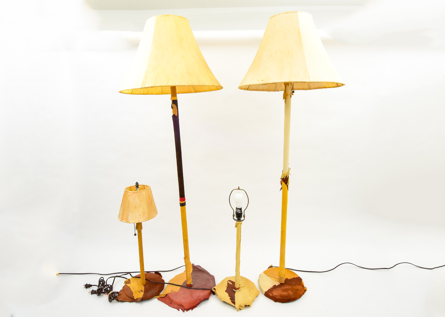 Grouping of Cowhide Lamps Including Nan Sheridan