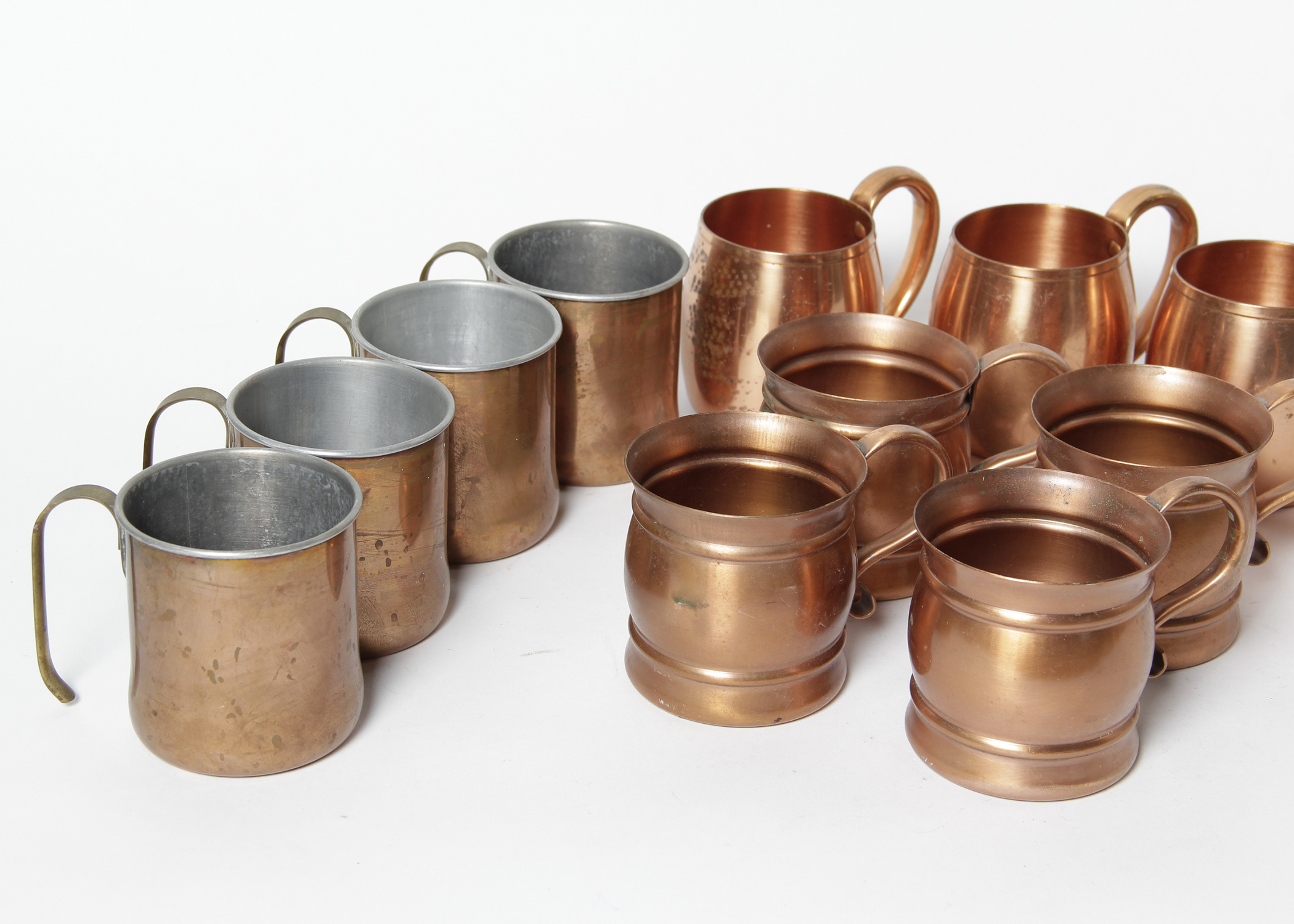 Collection of Twelve West Bend, Coppercaft and Gregorian Copper Mugs
