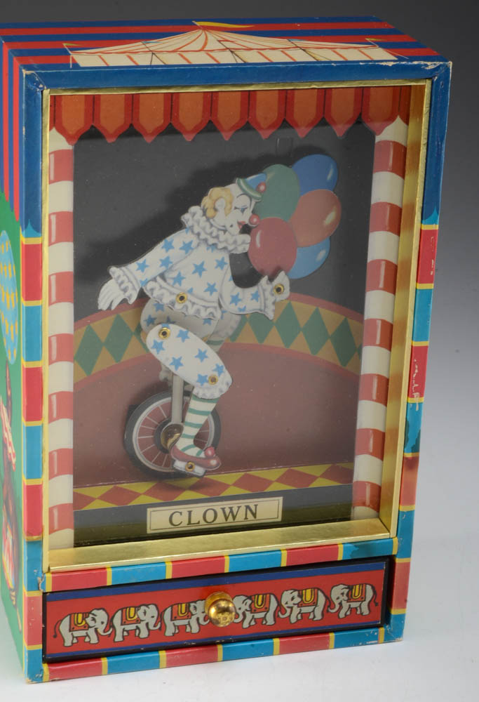 Collection of Vintage Wind-Up Toys and Music Boxes