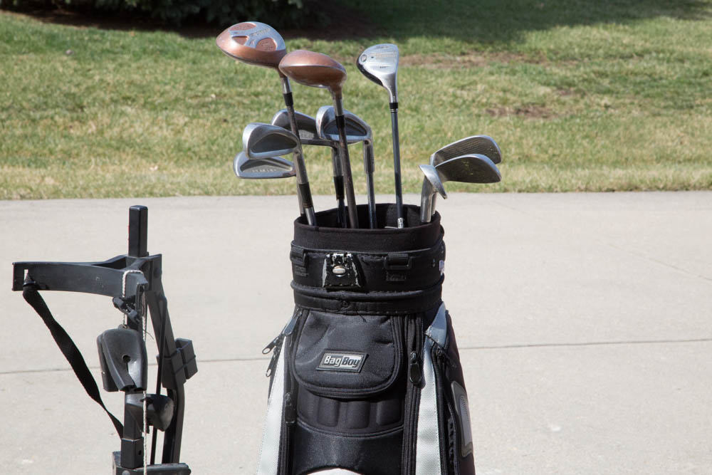 Collection of Golf Clubs with Rolling Caddy