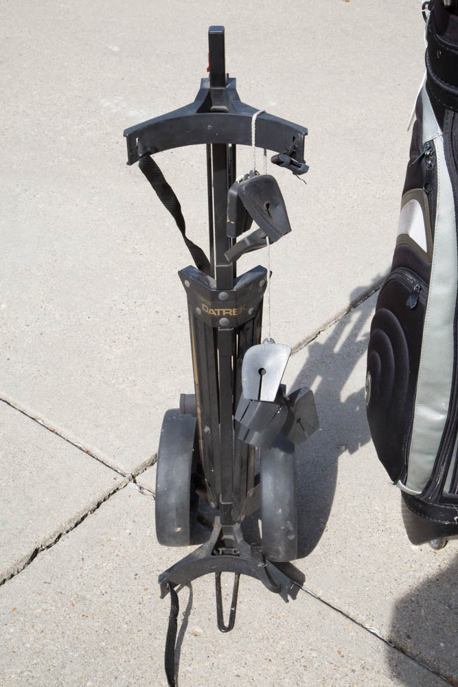 Collection of Golf Clubs with Rolling Caddy