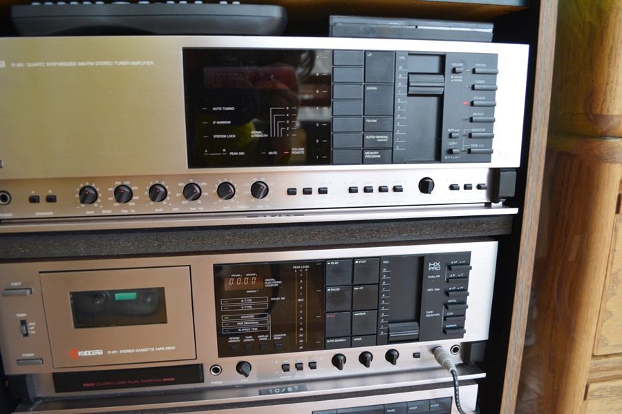 Kyocera Stereo System, Panasonic VHS/DVD and Laminate Cabinet
